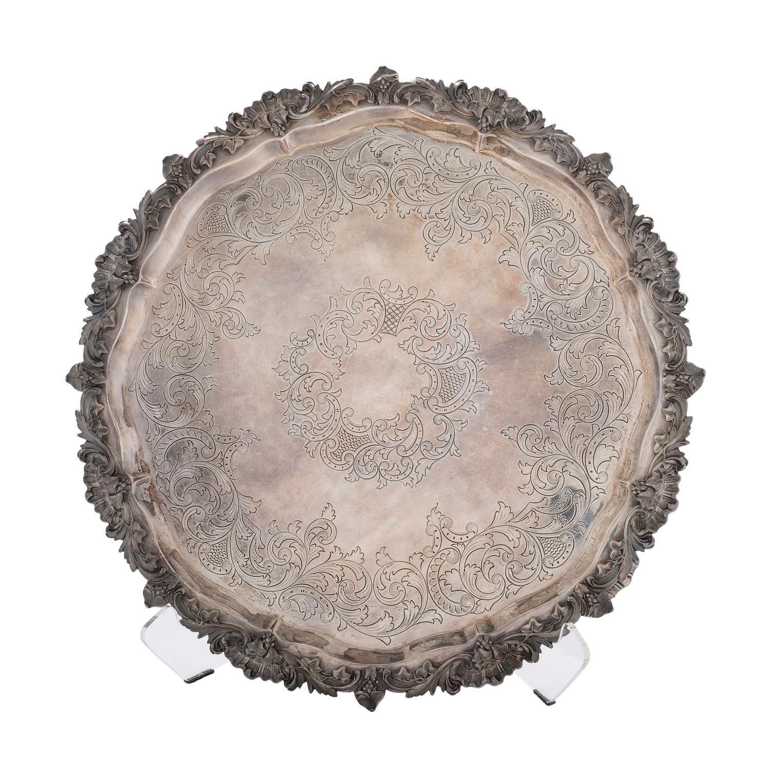 Four Silverplated Weighted Candlesticks and a Silverplated Tray