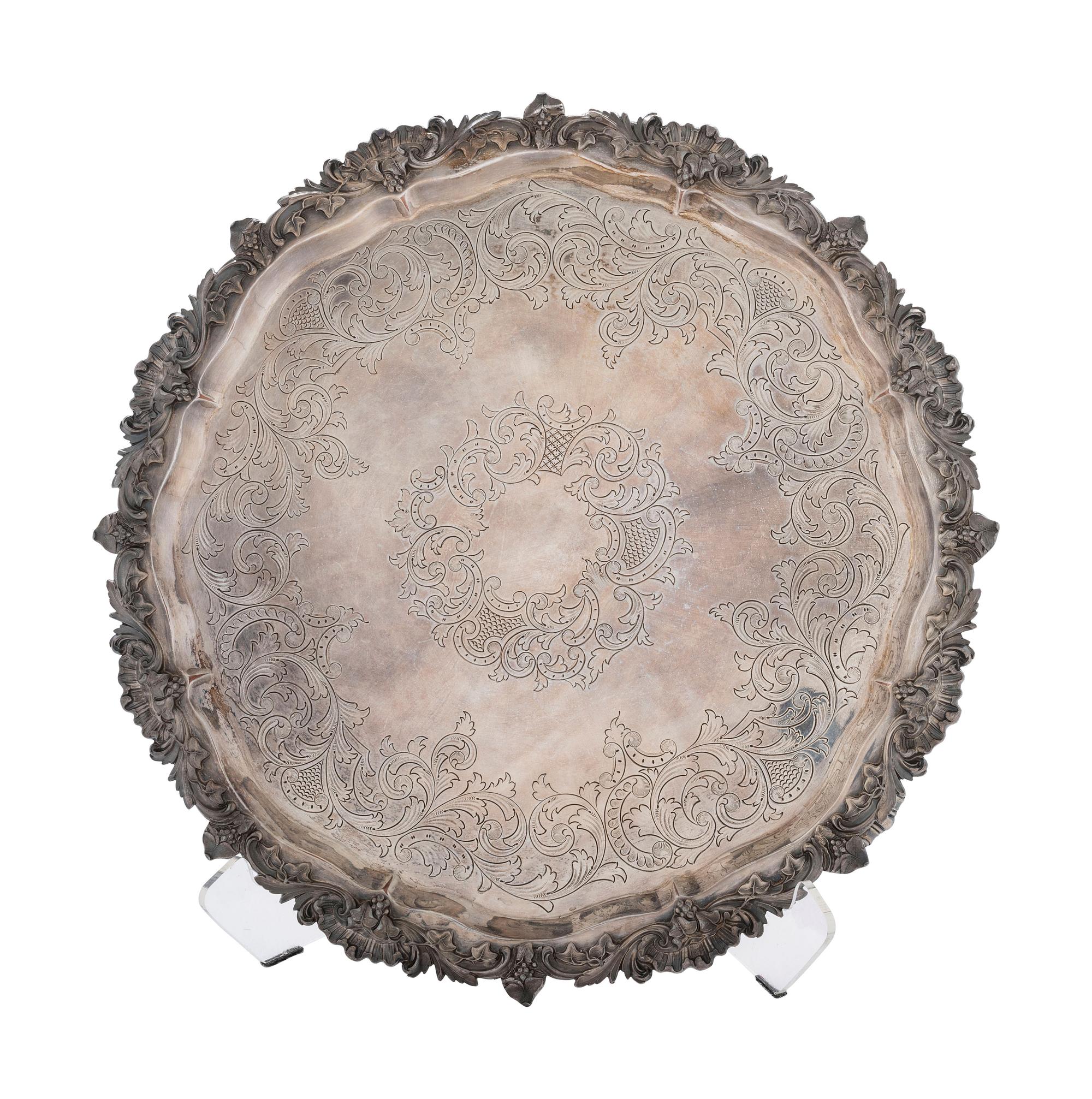 Four Silverplated Weighted Candlesticks and a Silverplated Tray