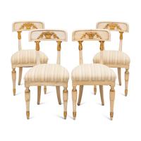 A Suite of Four Gustavian Style Painted and Parcel Gilt Chairs