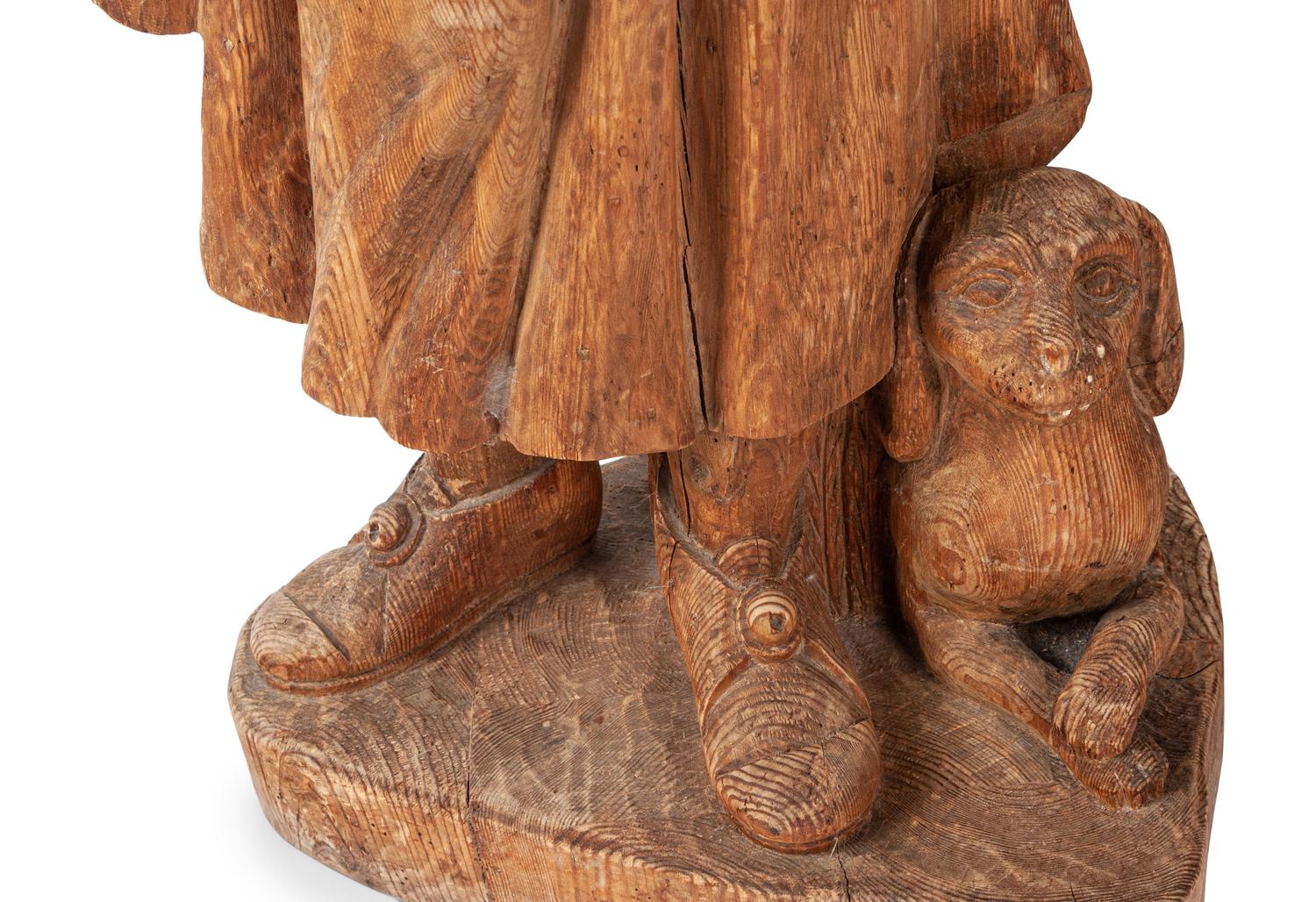 A Pair of Continental Carved Pine Figures