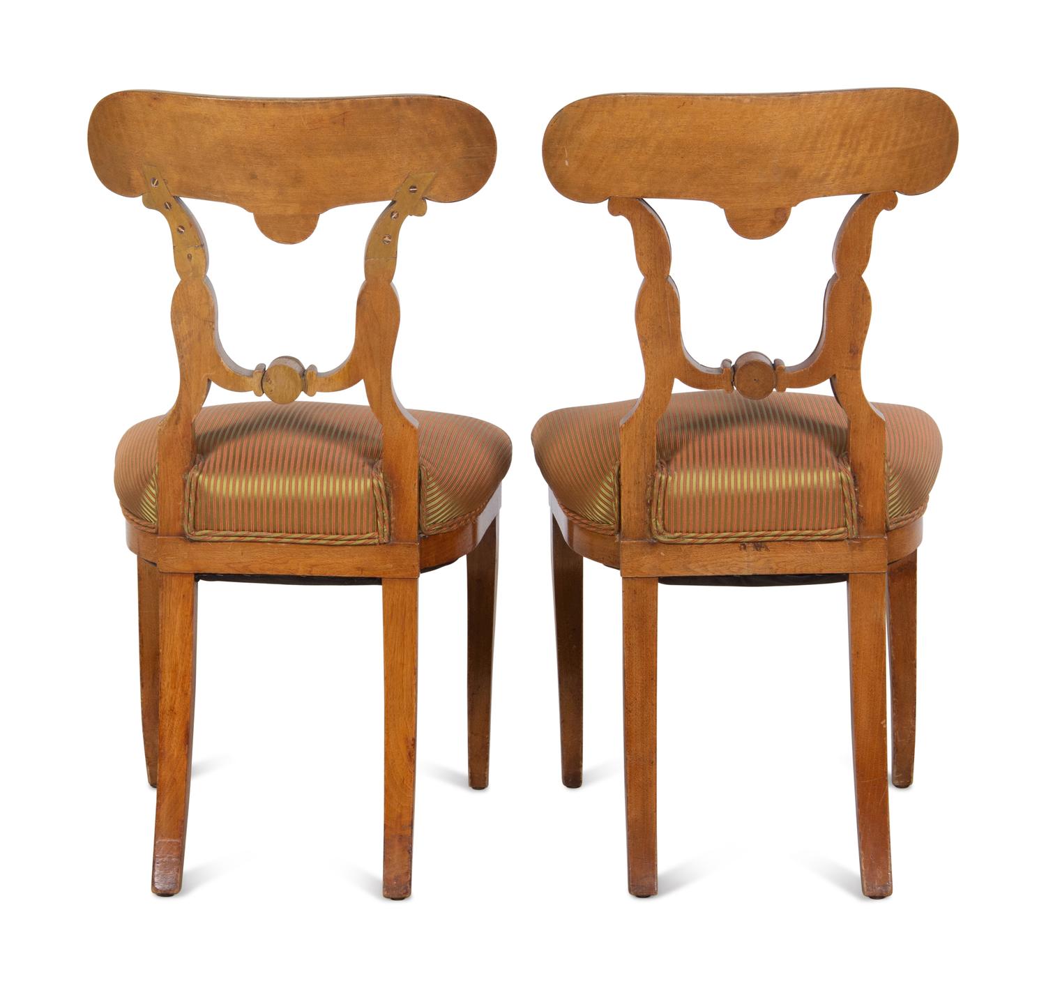 A Pair of Biedermeier Parcel-Gilt Birch Side Chairs