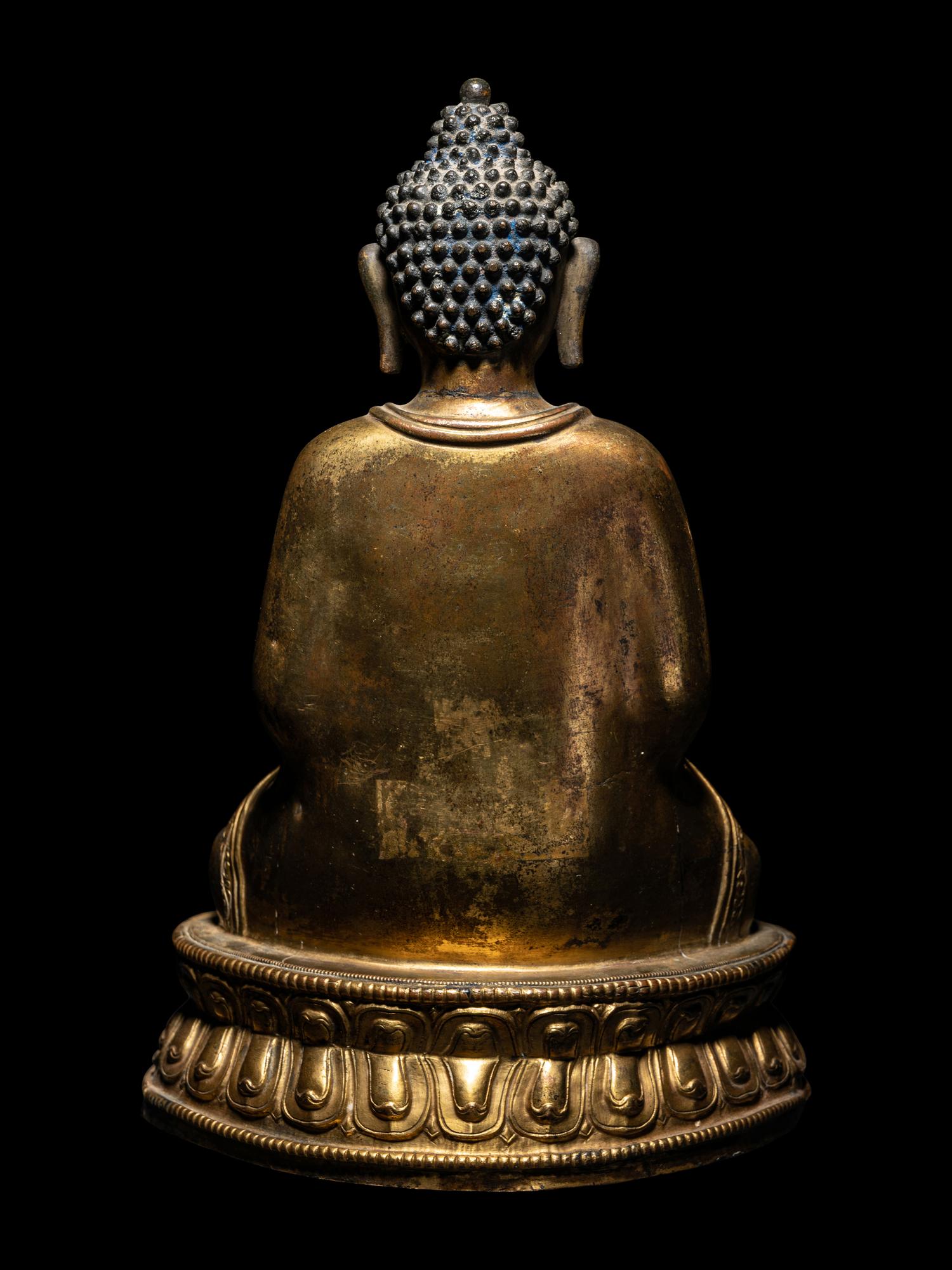 A Large Tibetan Gilt Bronze Figure of Seated Buddha