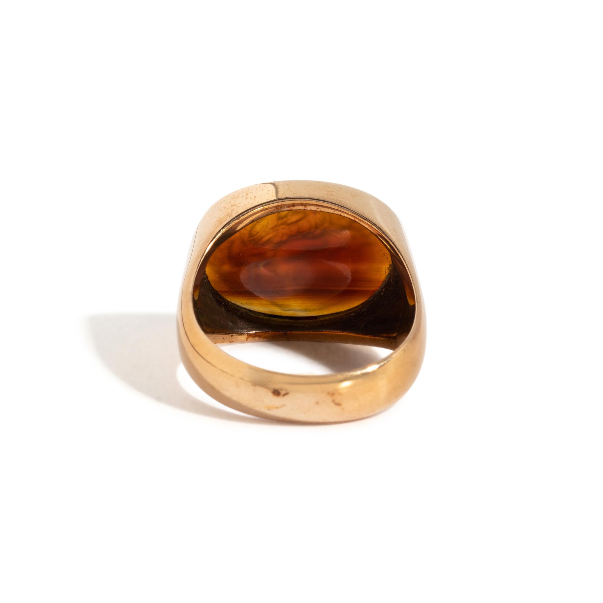A Neoclassical Carnelian and Gold Finger Ring with a Roman Triumvir
