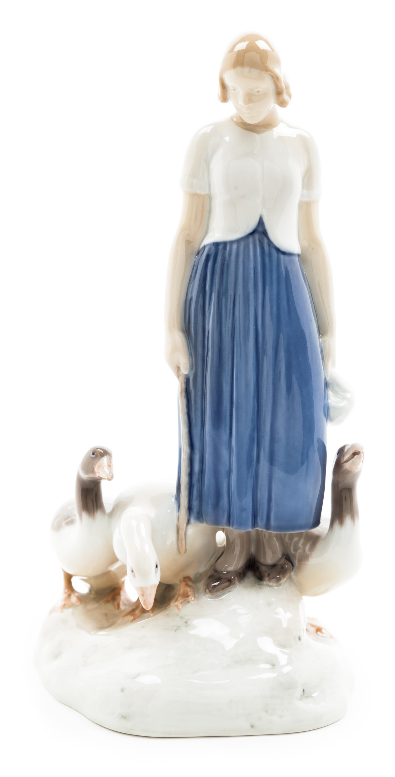 A Bing and Grondahl Porcelain Figural Group Height 9 3/4 inches.