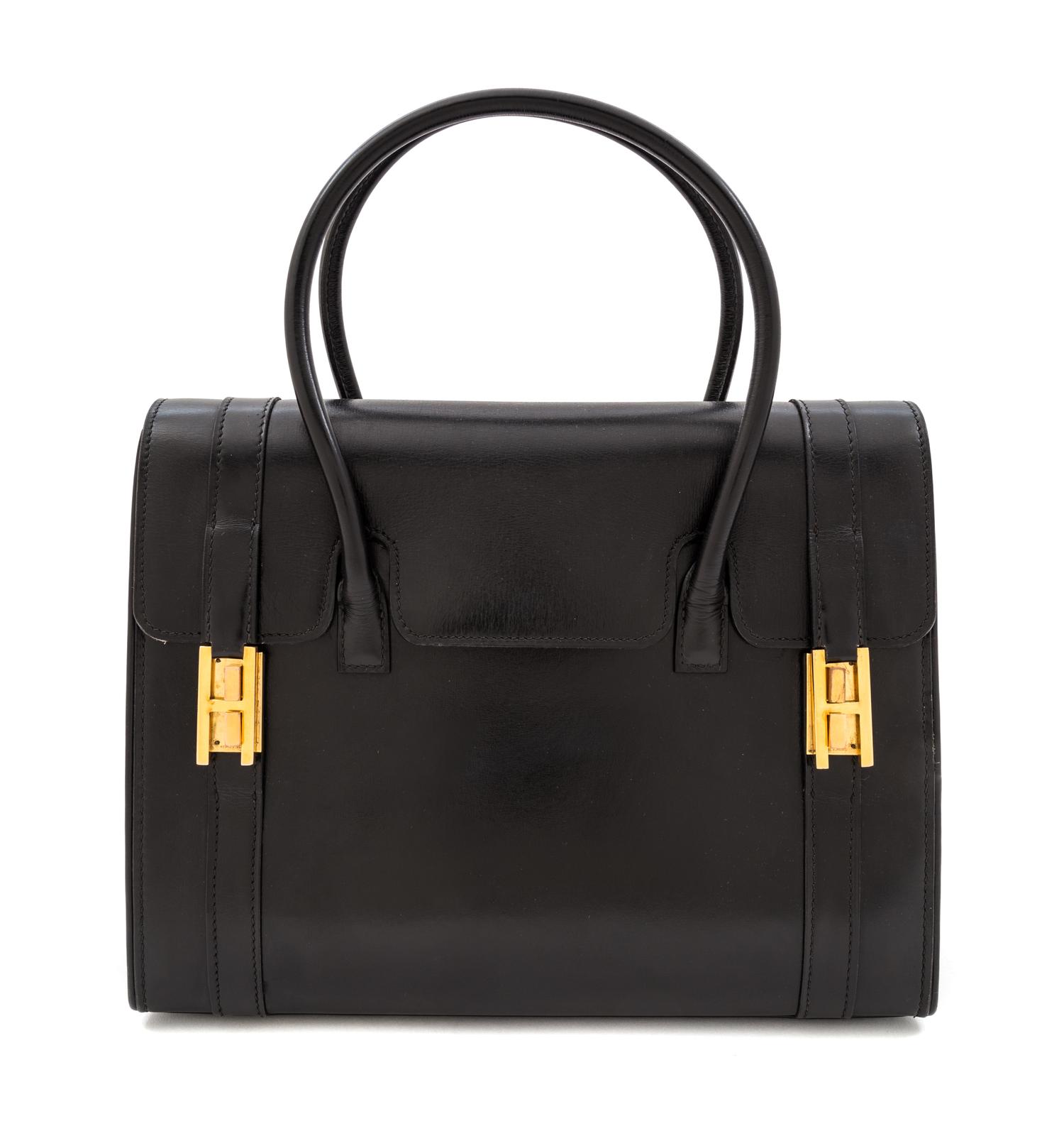 An Hermes Black Leather Drag Handbag, 10" x 8" x 4".