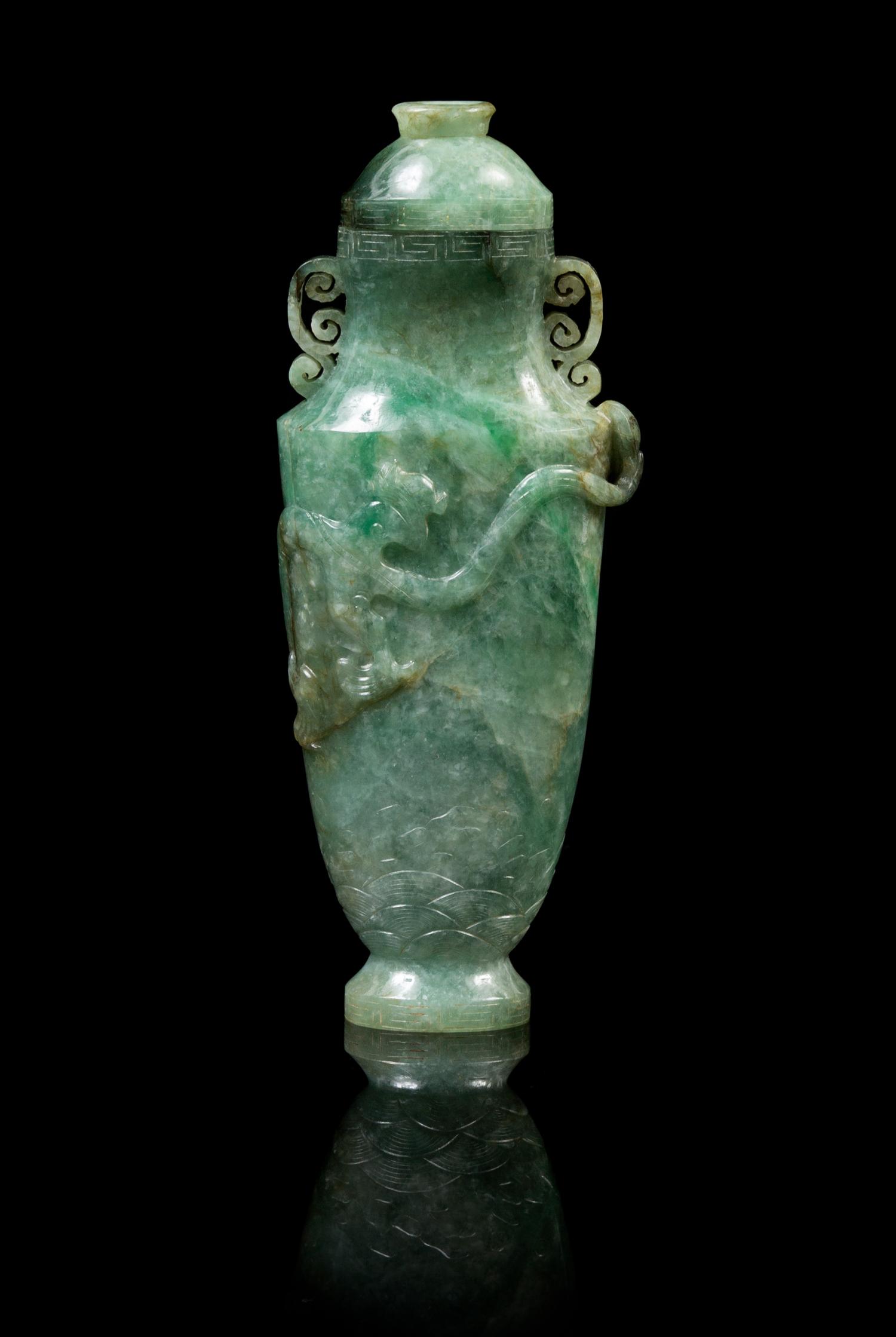 A Chinese Jadeite Covered Vase LATE 19TH/EARLY 20TH CENTURY Height 6 7/8 x width 2 3/4 inches (with cover). — LATE 19TH/EARLY 20TH CENTURY