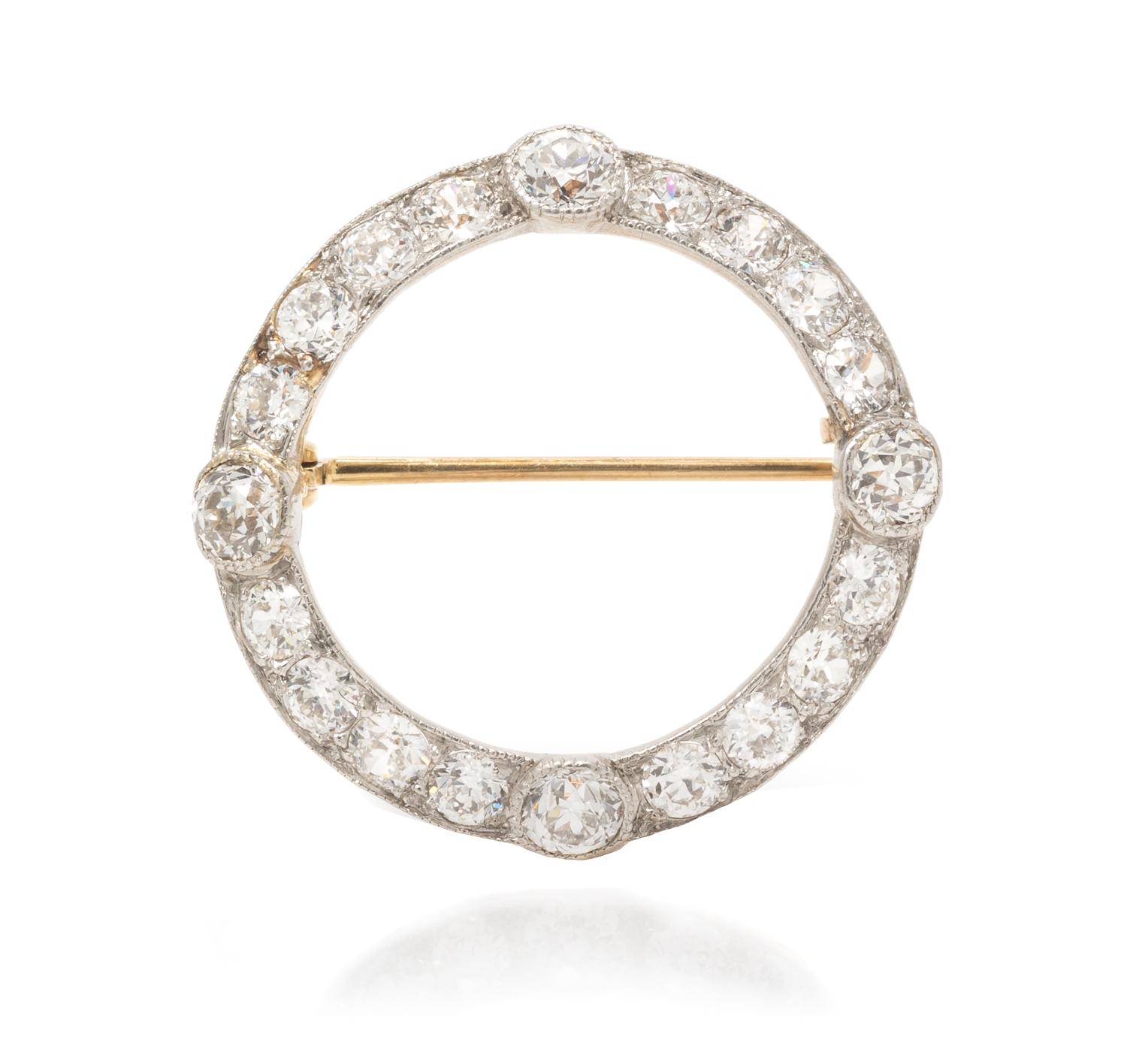 An Edwardian Platinum Topped Gold and Diamond Circle Brooch, 2.80 dwts.