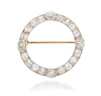 An Edwardian Platinum Topped Gold and Diamond Circle Brooch, 2.80 dwts.