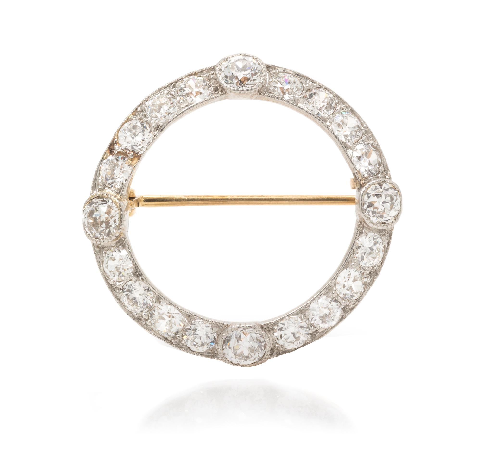 An Edwardian Platinum Topped Gold and Diamond Circle Brooch, 2.80 dwts.