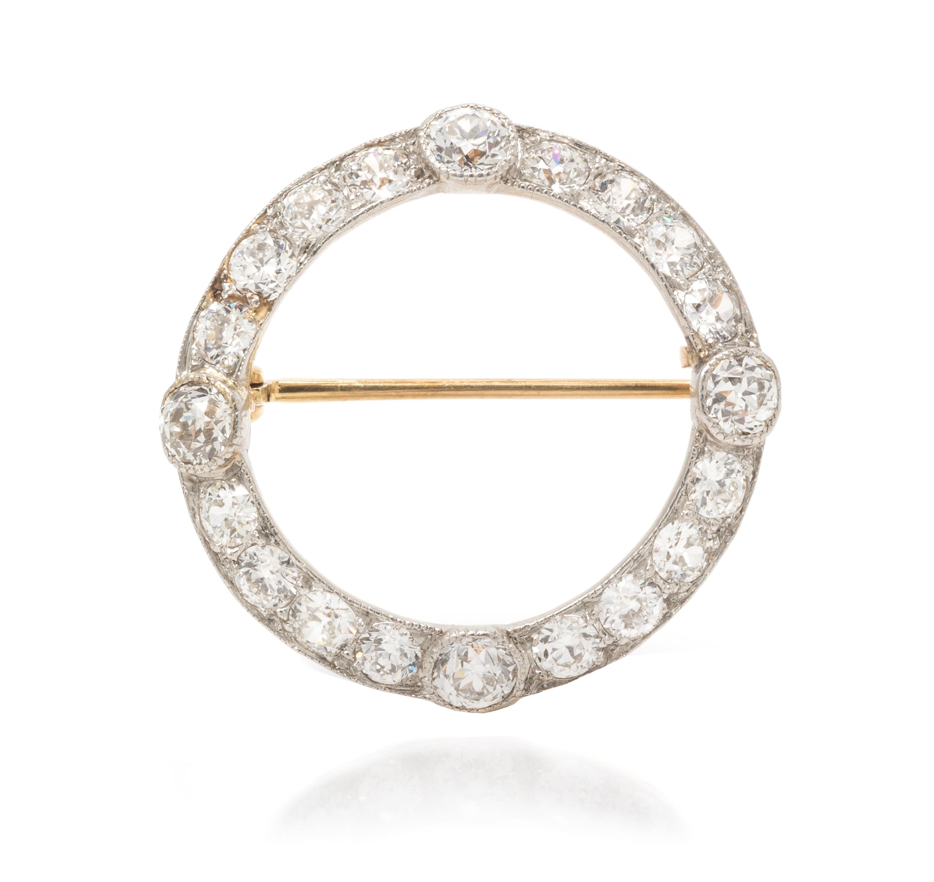 An Edwardian Platinum Topped Gold and Diamond Circle Brooch, 2.80 dwts.