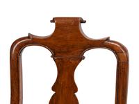 A Set of Eight Dutch Rococo Walnut Dining Chairs