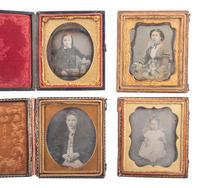 [EARLY PHOTOGRAPHY]. A group of 24 daguerreotype portraits of children and young adults, including: