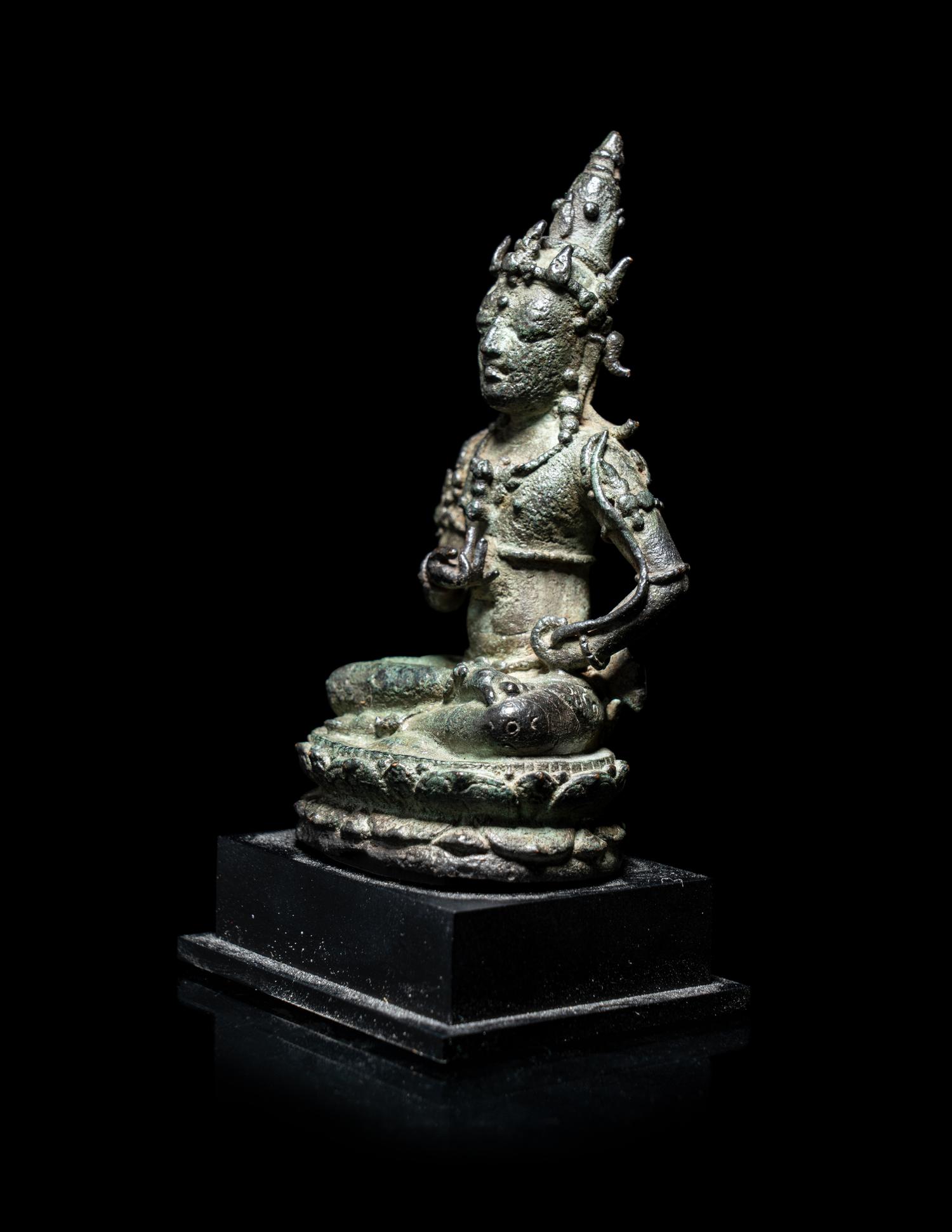 A Small Indonesian Bronze Figure of a Female Retinue