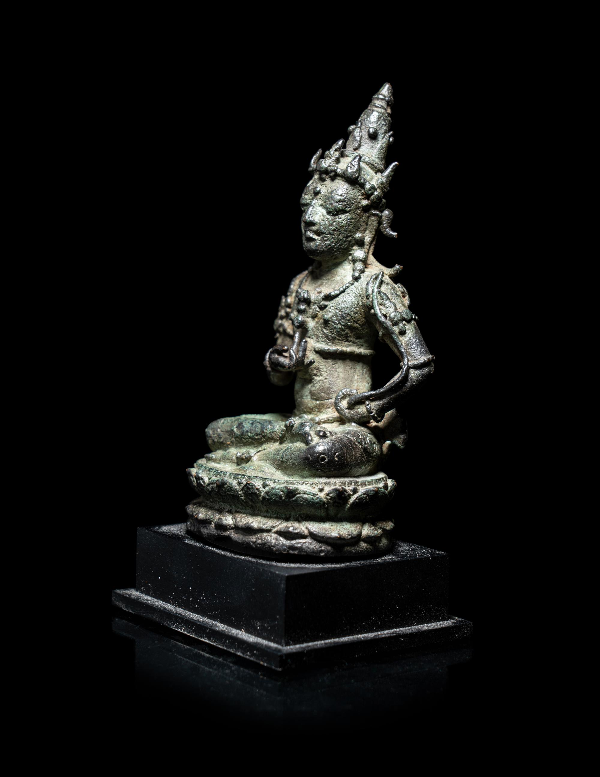 A Small Indonesian Bronze Figure of a Female Retinue