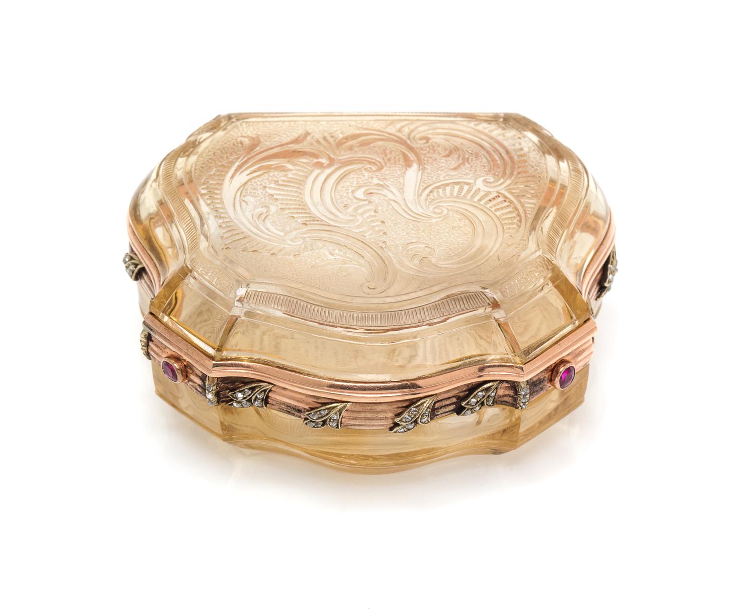 A Russian Gold Mounted and Jeweled Carved Topaz Box, St. Petersburg, 19th Century, of shield form with incised rocaille decoration, wit