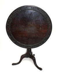 A Victorian Style Carved Oak Tilt-Top Tea Table