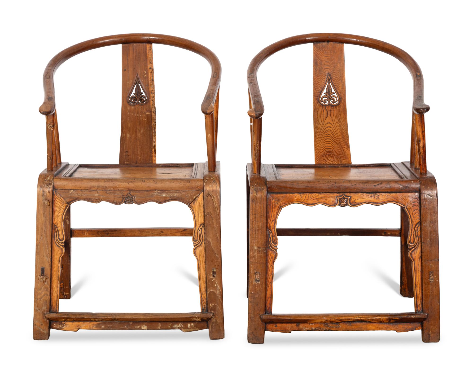 A Pair of Ming Style Elm Horseshoe Back Armchairs