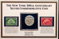 A Group of Four Commemorative 50c Coin and Stamp Sets