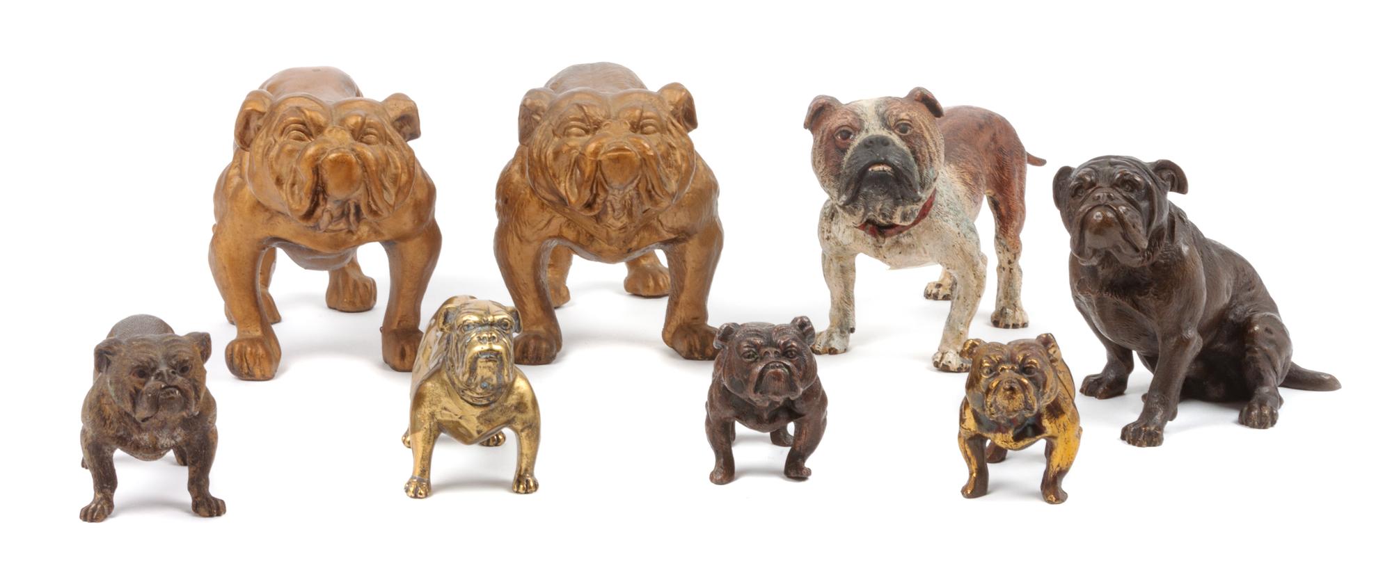 A Group of Eight Bronze and Metal Bulldogs Width of widest 8 inches.