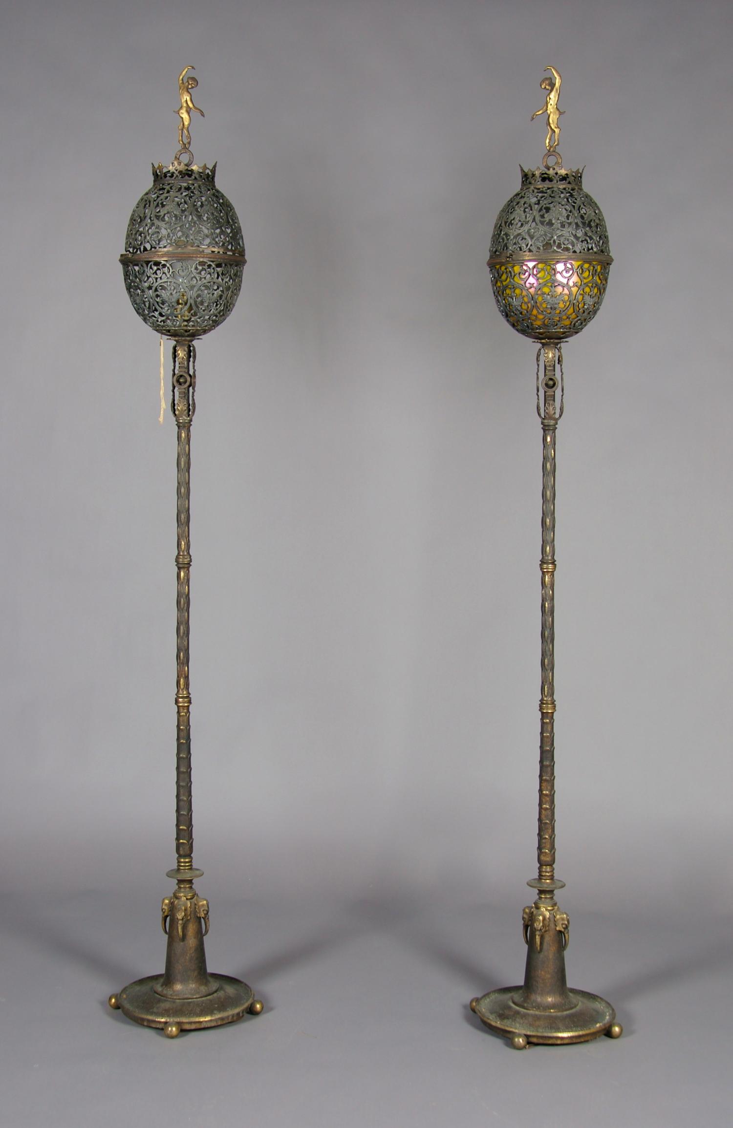 A Pair of Iron and Gilt Bronze Torcheres, Oscar B. Bach, Height 77 inches.