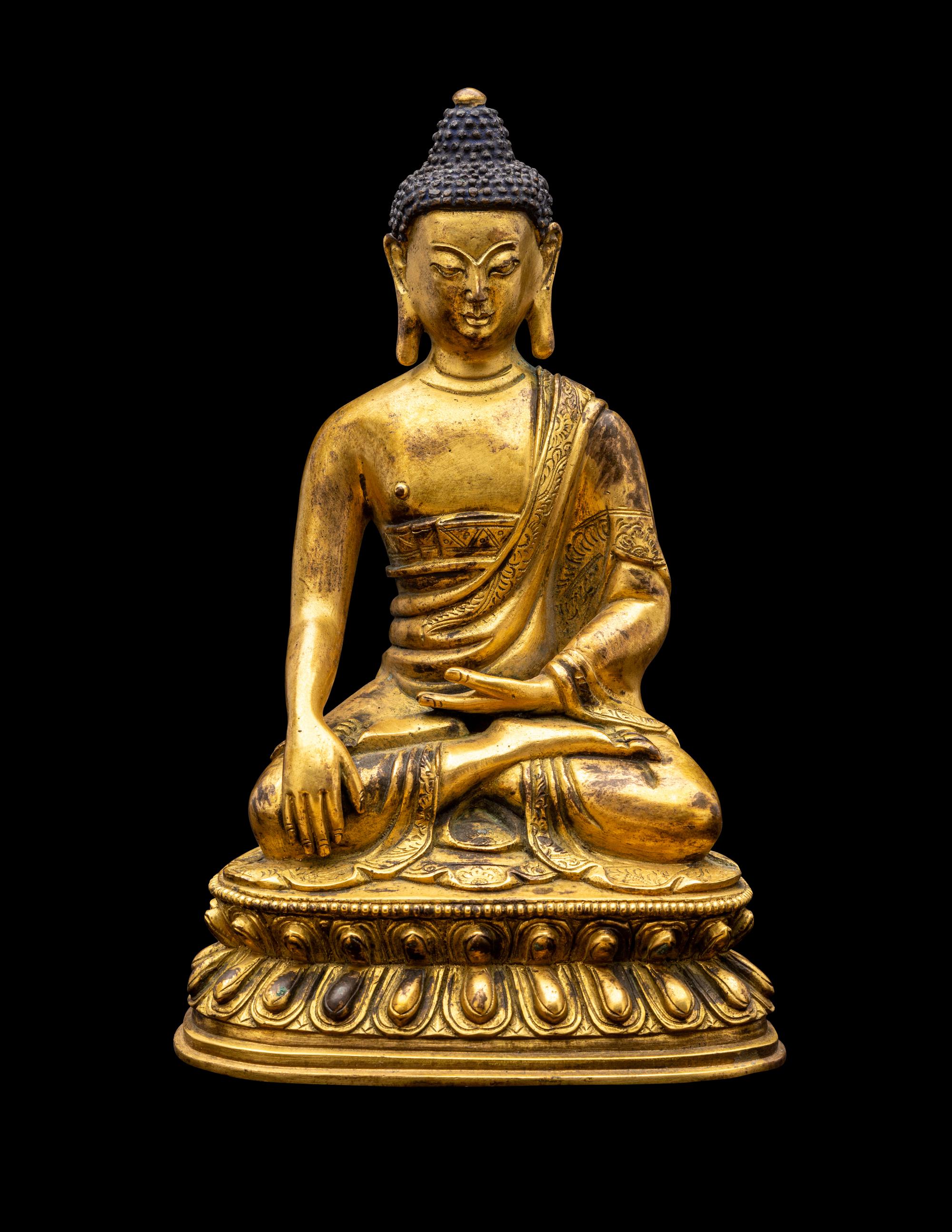 A Sino-Tibetan Gilt Bronze Figure of Seated Buddha