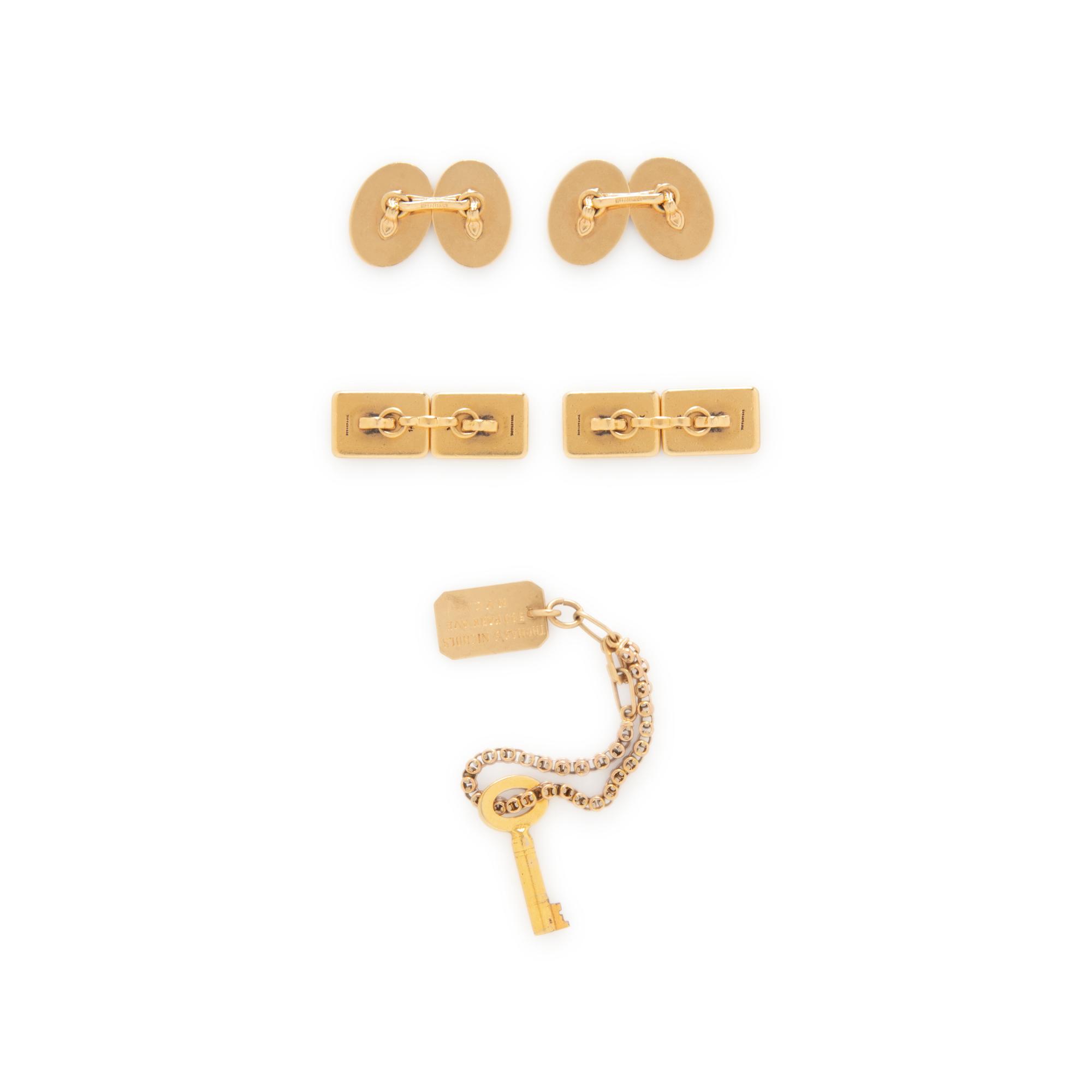 TWO PAIRS OF TIFFANY & CO. CUFFLINKS AND A CHARM