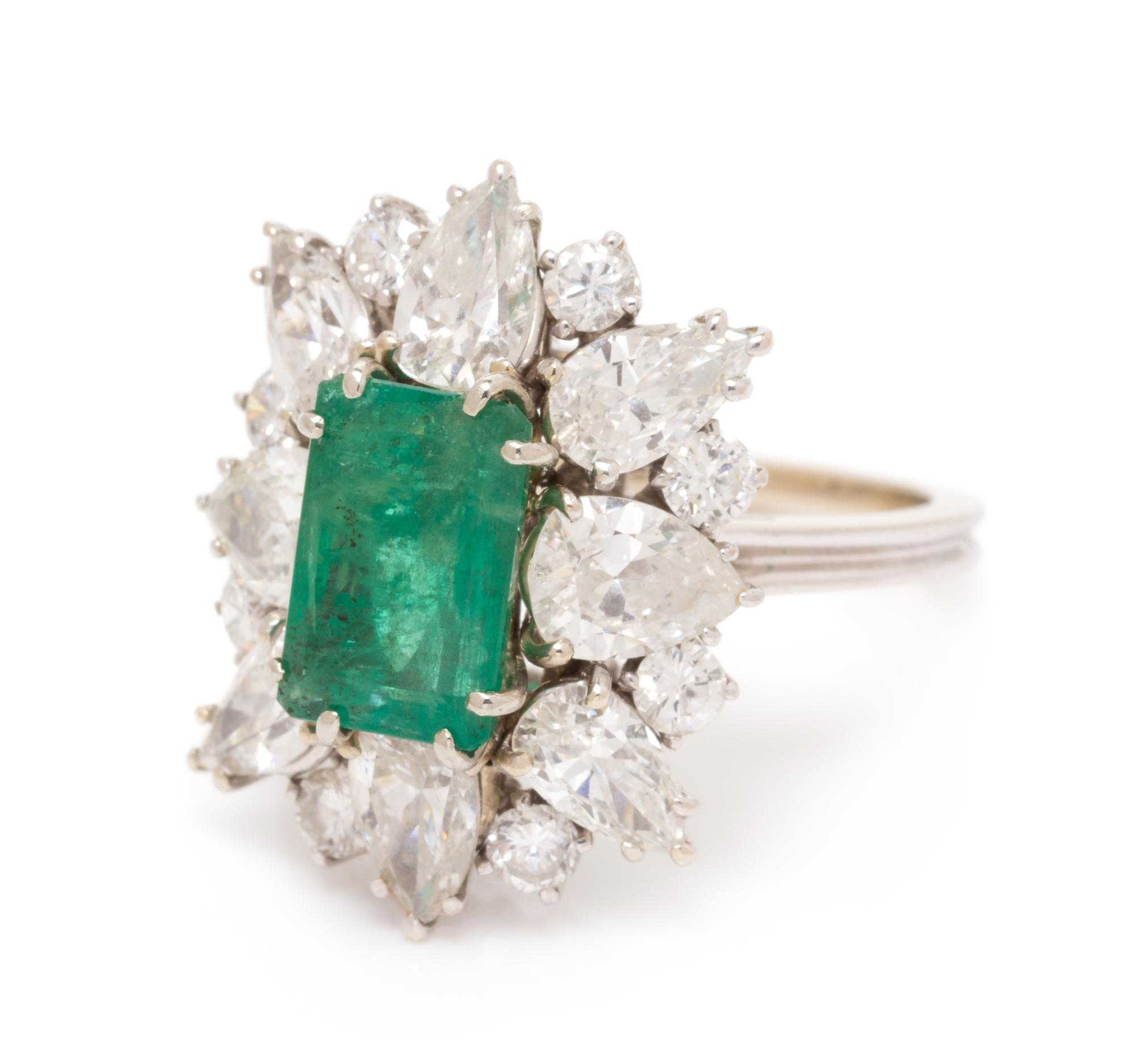 An 18 Karat White Gold, Emerald and Diamond Ring, 4.10 dwts.
