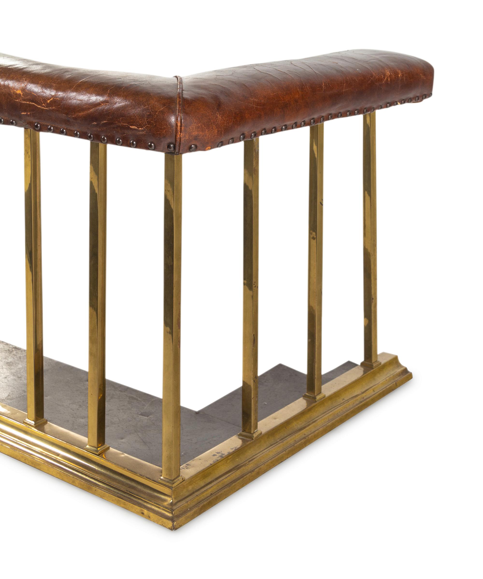 An English Leather-Upholstered Brass Club Fender