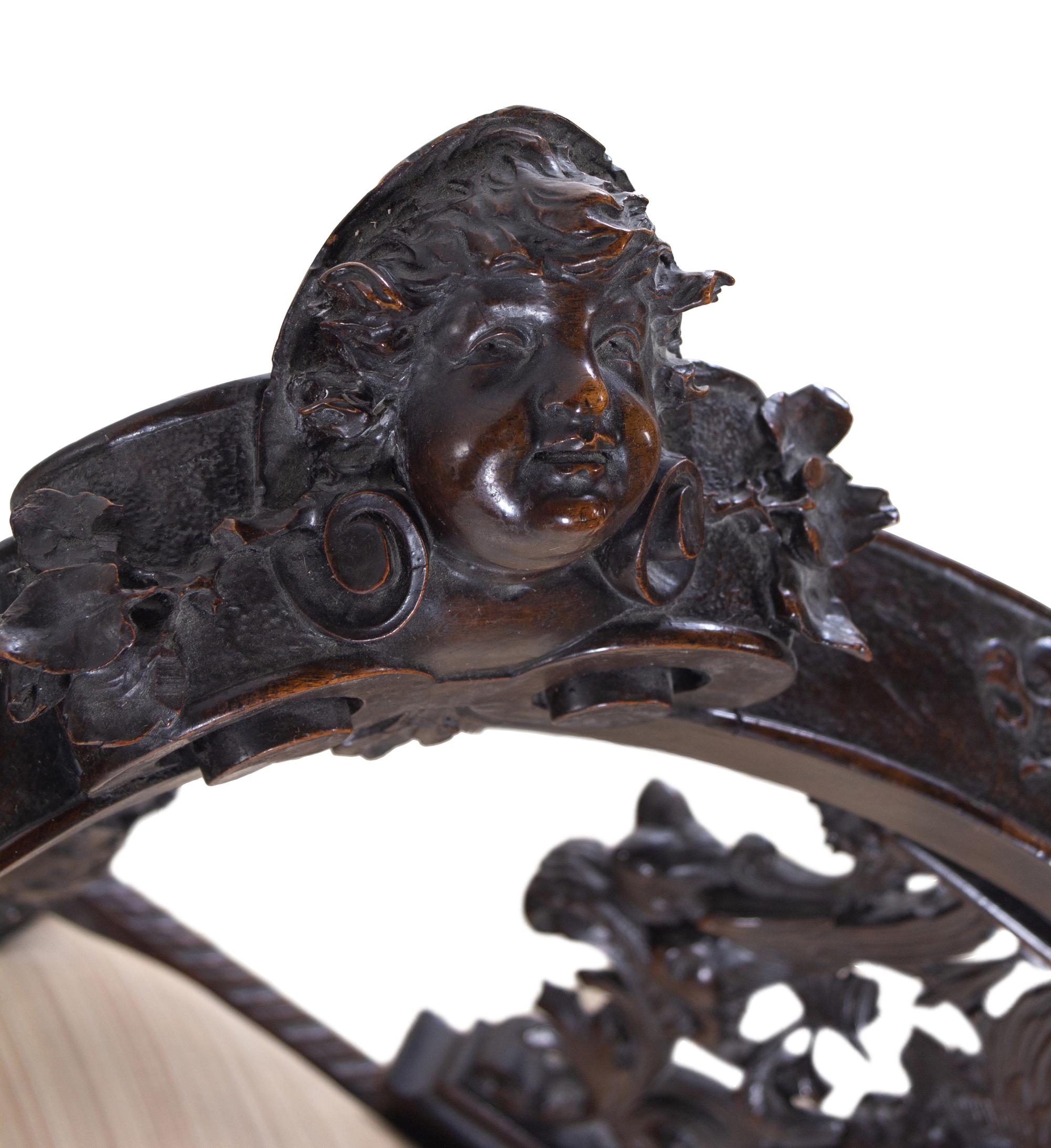 A Renaissance Revival Carved Walnut Corner Chair
