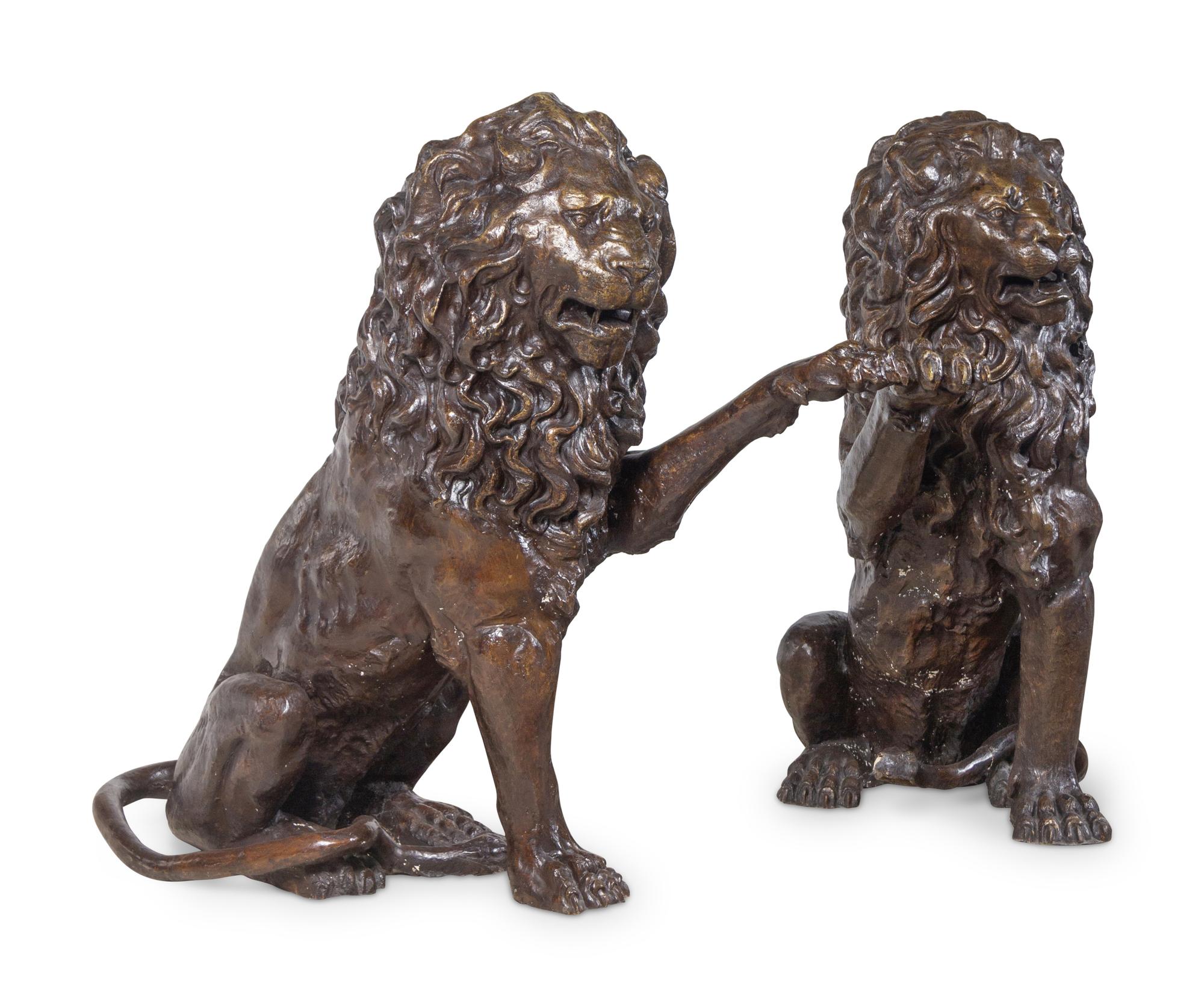 A Pair of Patinated Bronze Lions