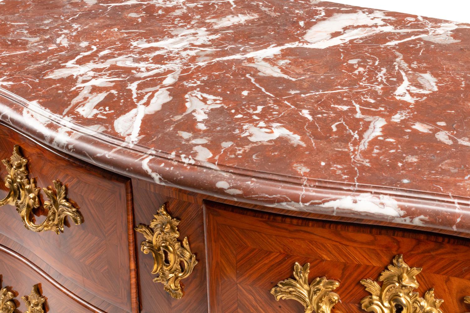 A Régence Gilt Bronze Mounted Tulipwood Marble-Top Commode