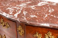 A Régence Gilt Bronze Mounted Tulipwood Marble-Top Commode