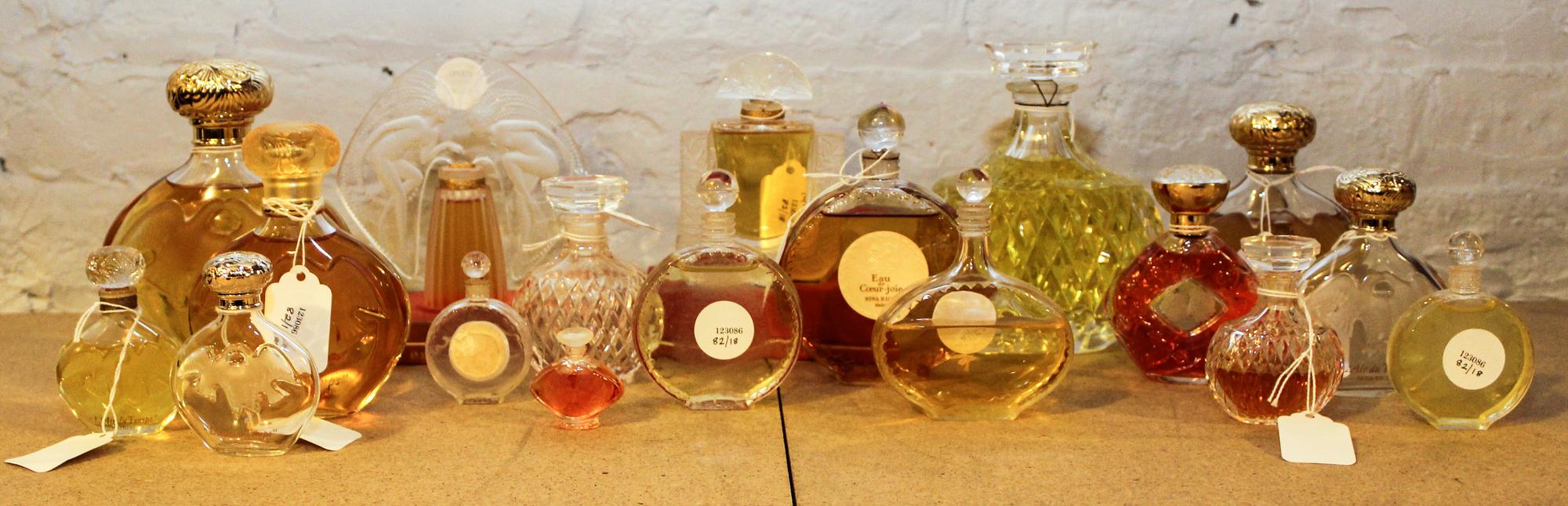 A Collection of Eighteen Lalique and Other French Glass Perfume Bottles. Height of tallest 6 1/2 inches.