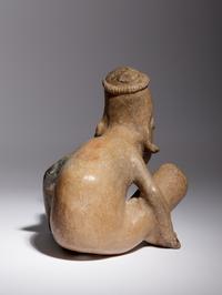 A Jalisco Pottery Crouching Figure