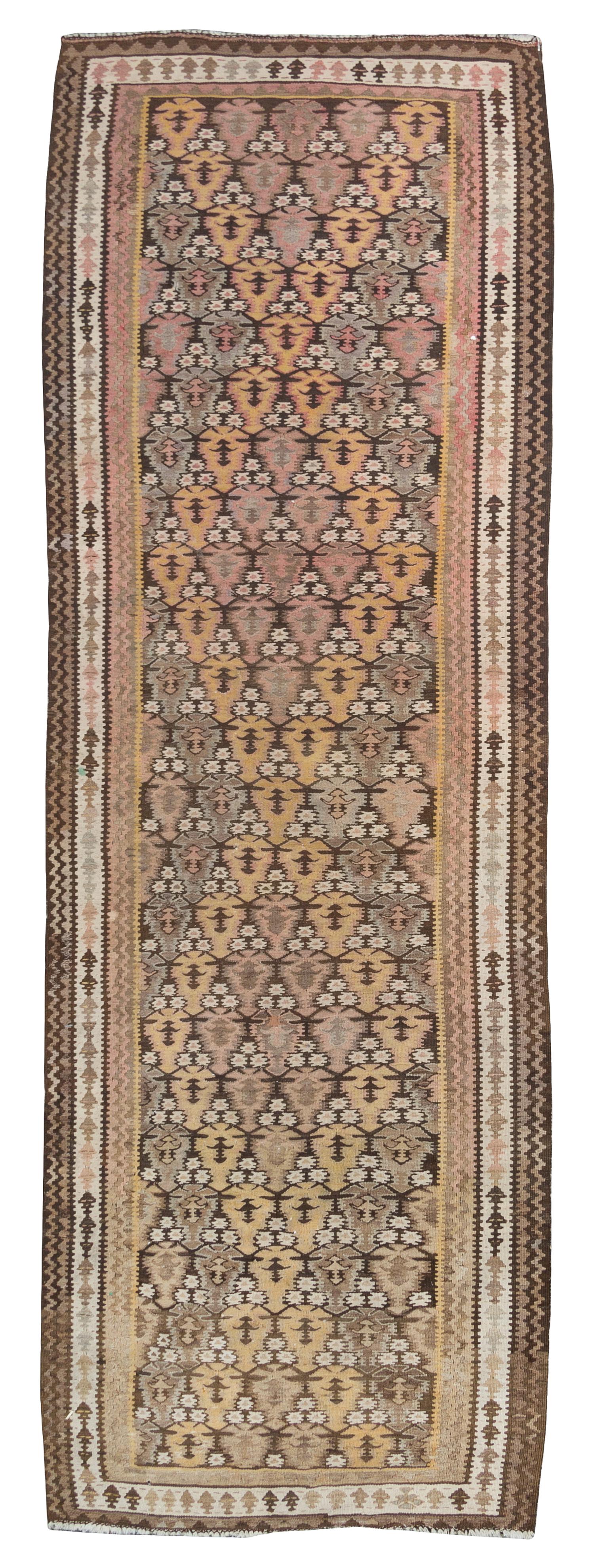 A Turkish Kilim Rug 8 feet 6 inches x 3 feet 8 inches.