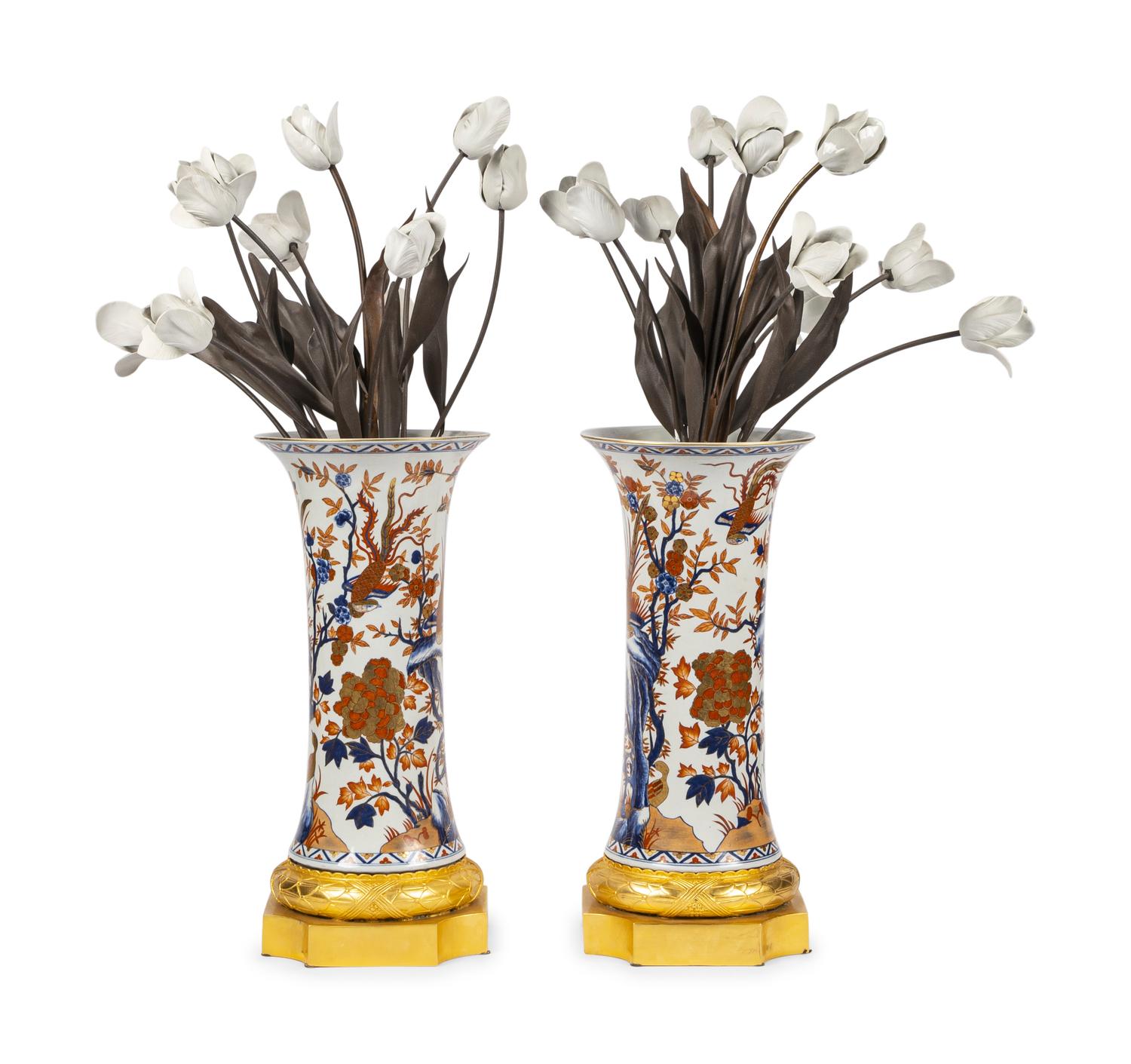 A Pair of Gilt Bronze Mounted Imari Palette Porcelain Vases with Biscuit Porcelain Tulip Arrangements