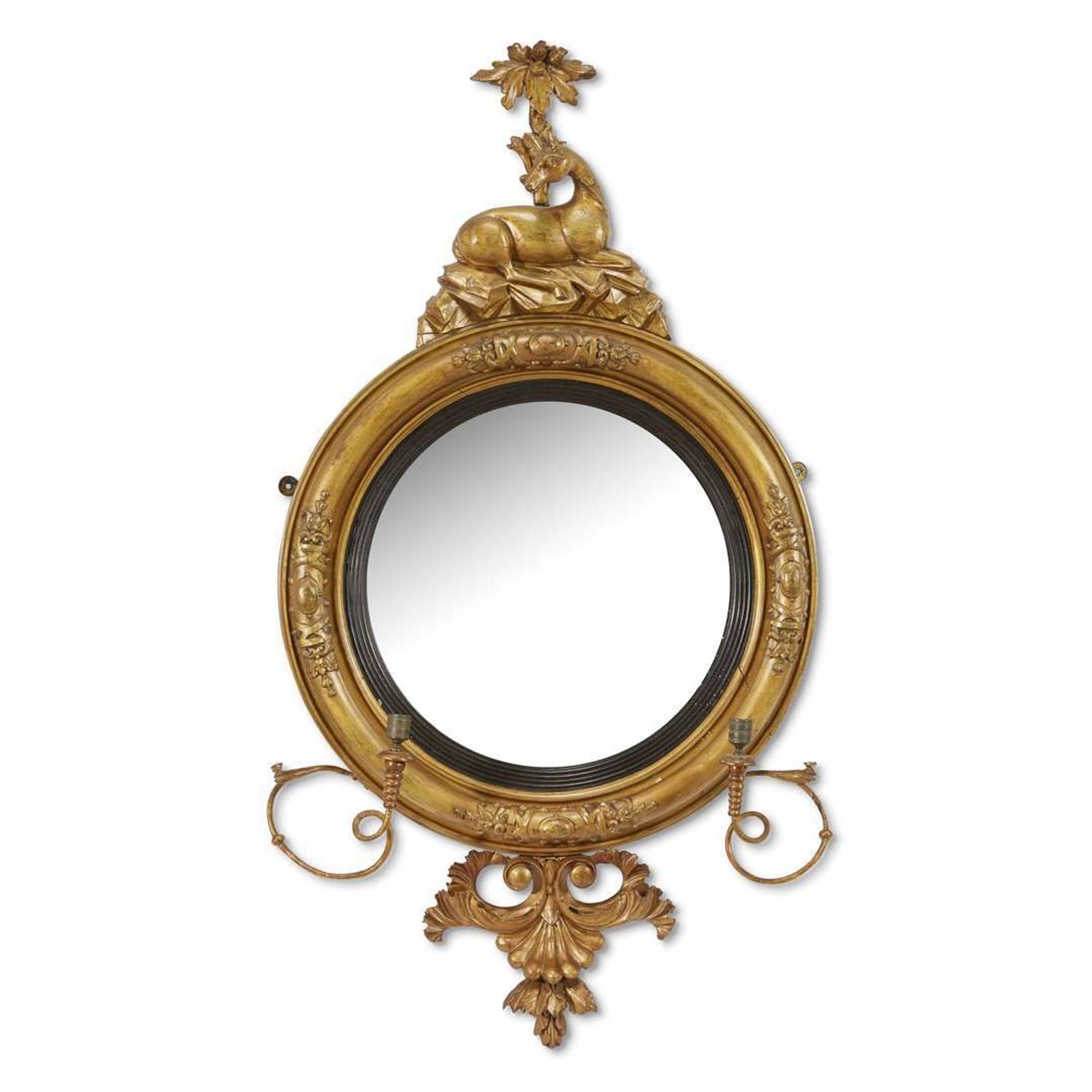 Classical carved giltwood girandole bull's-eye looking glass early 19th century