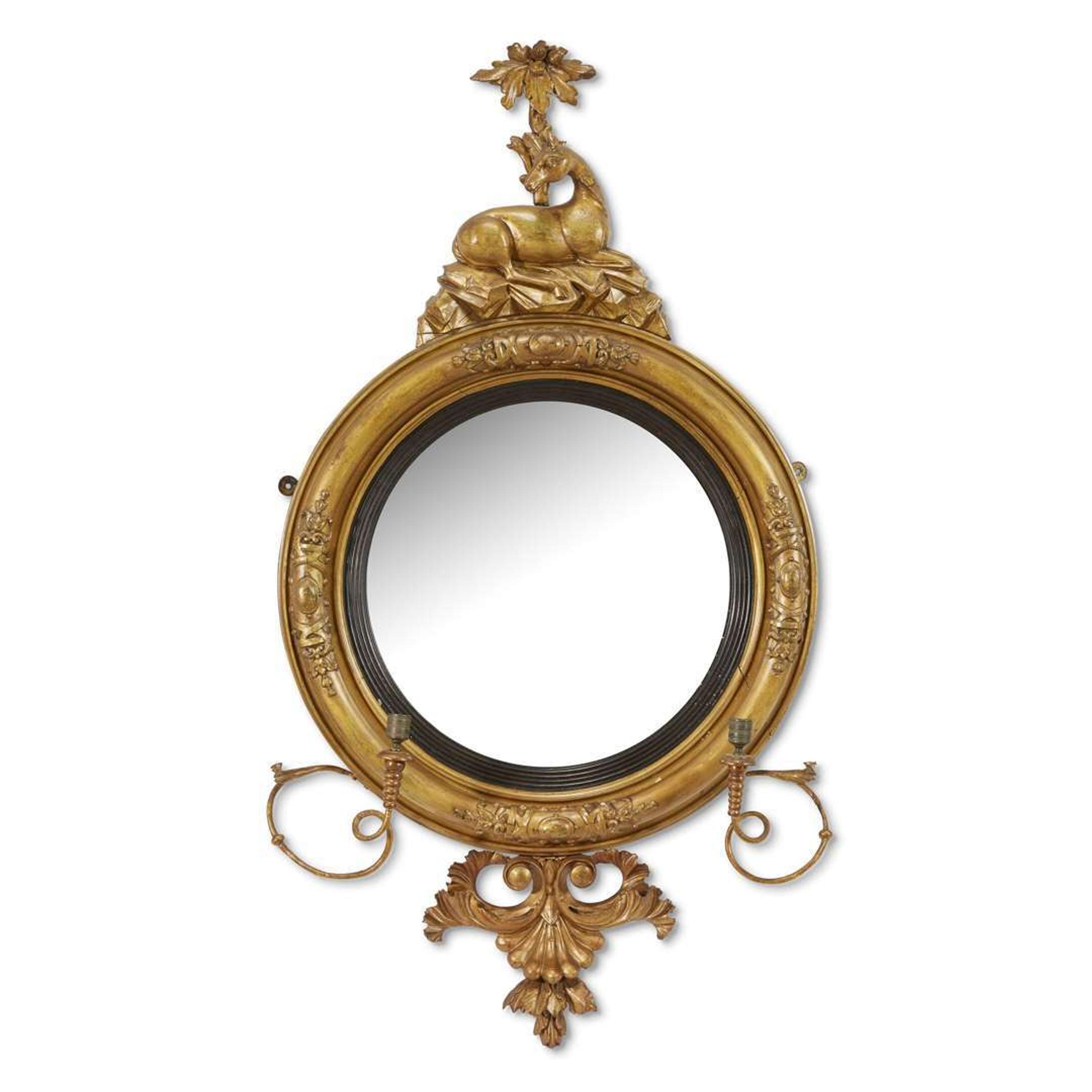 Classical carved giltwood girandole bull's-eye looking glass early 19th century