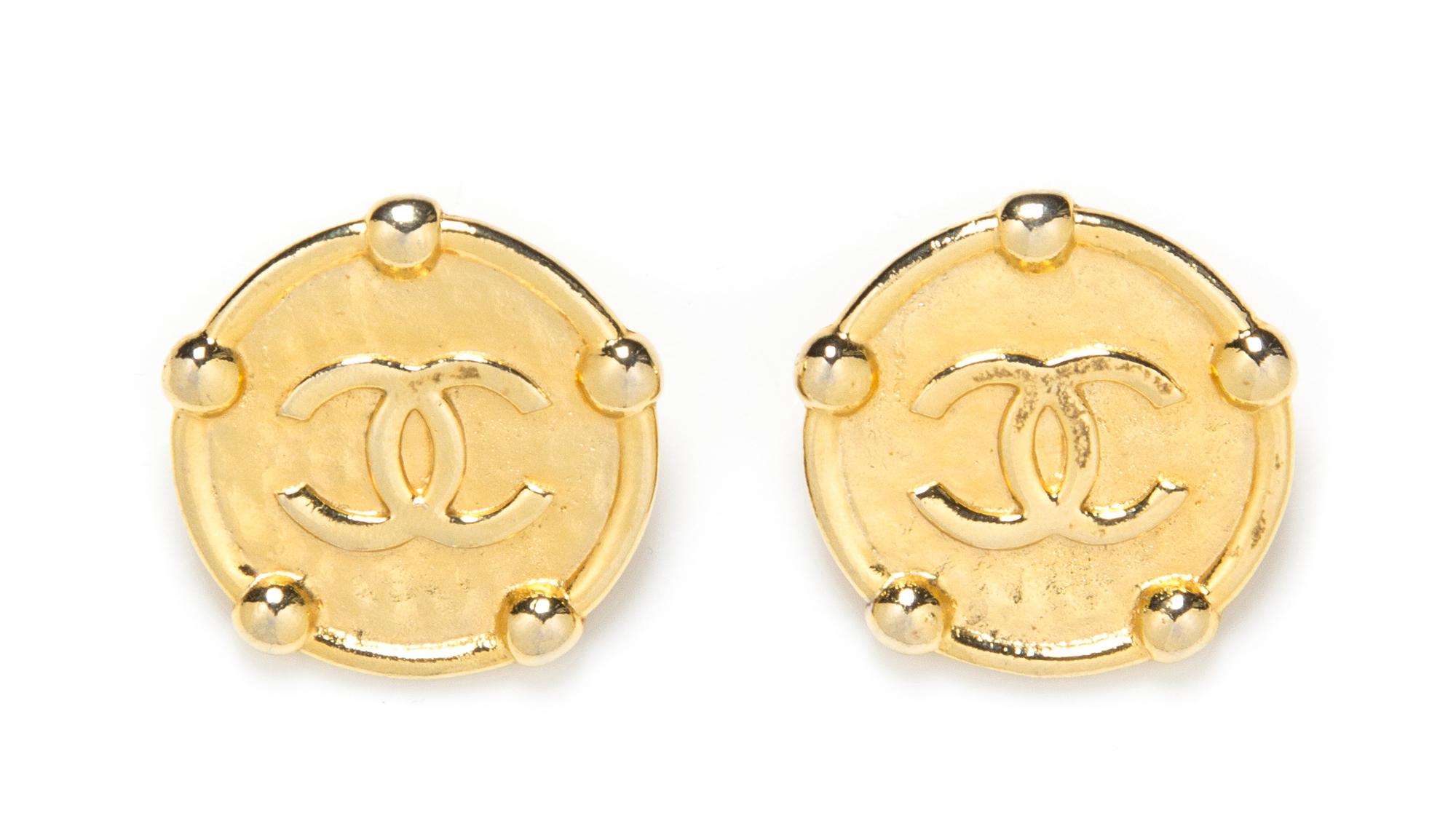 A Pair of Chanel Hammered Goldtone Earclips, 1.5" x 1.5".