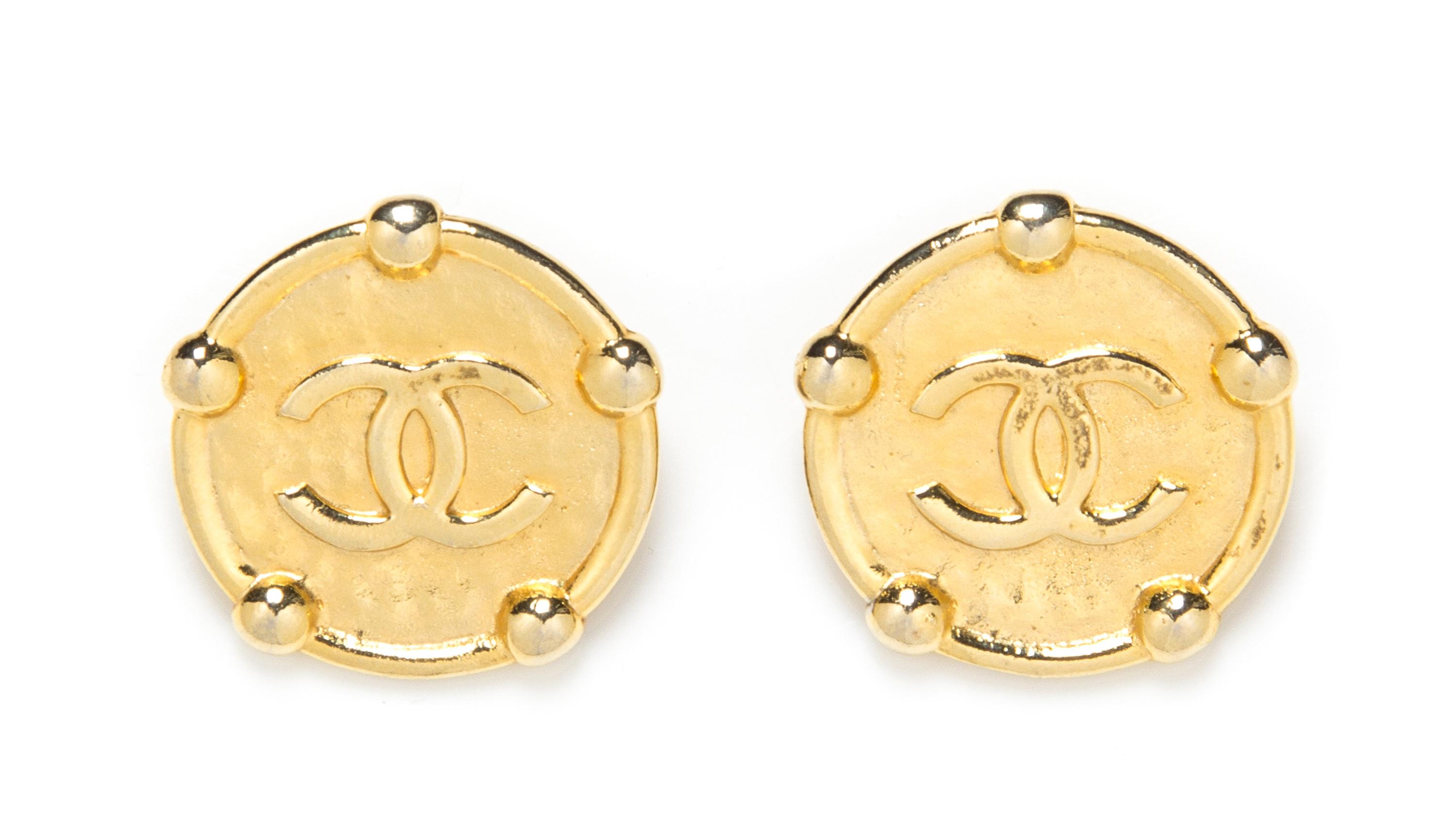 A Pair of Chanel Hammered Goldtone Earclips, 1.5" x 1.5".
