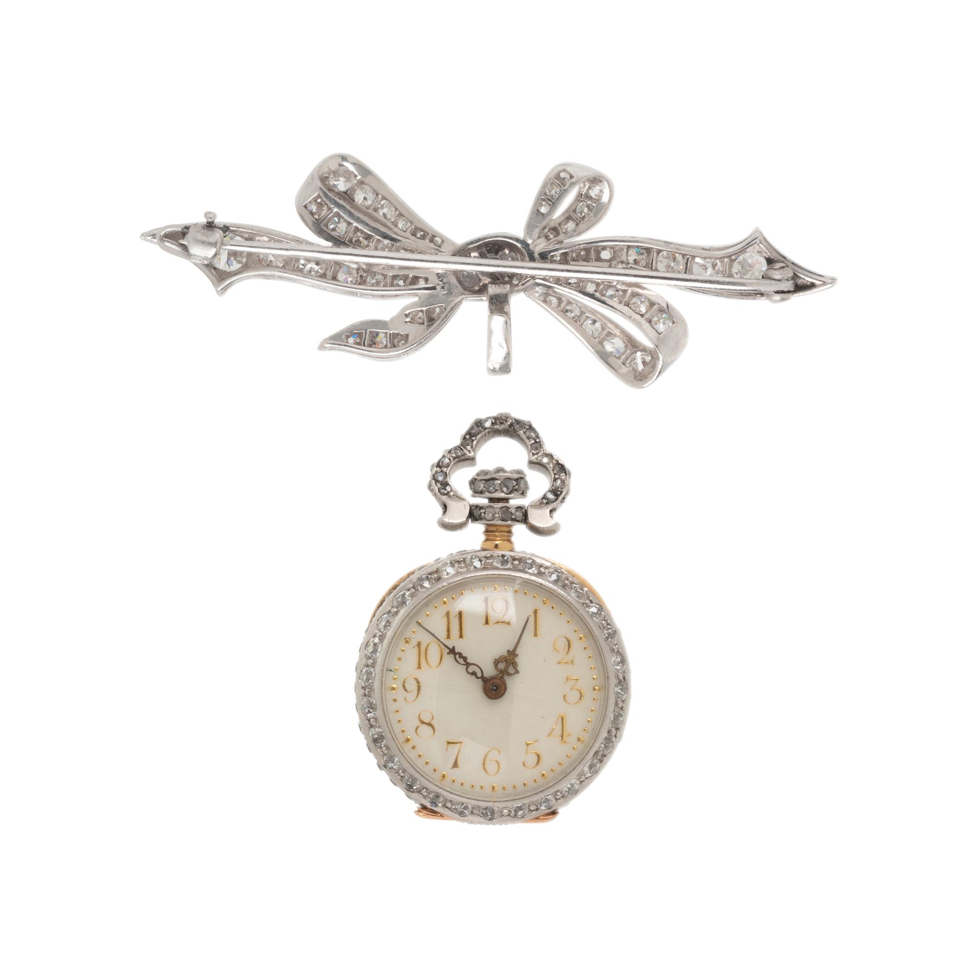 DIAMOND AND PLATINUM LAPEL WATCH