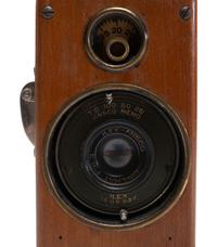[EARLY PHOTOGRAPHY]. Ansco Memo camera with polished wooden body.