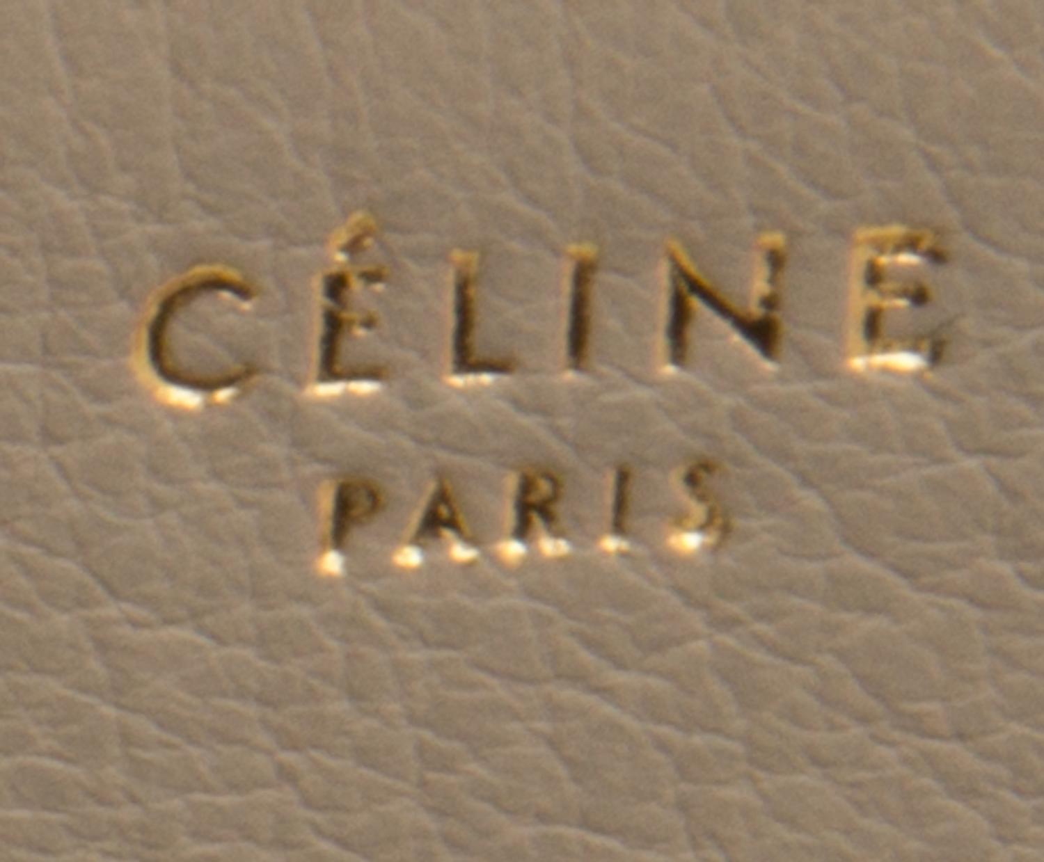 A Celine Taupe and Black Leather Edge Handbag, 14" x 11" x 7".