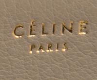 A Celine Taupe and Black Leather Edge Handbag, 14" x 11" x 7".