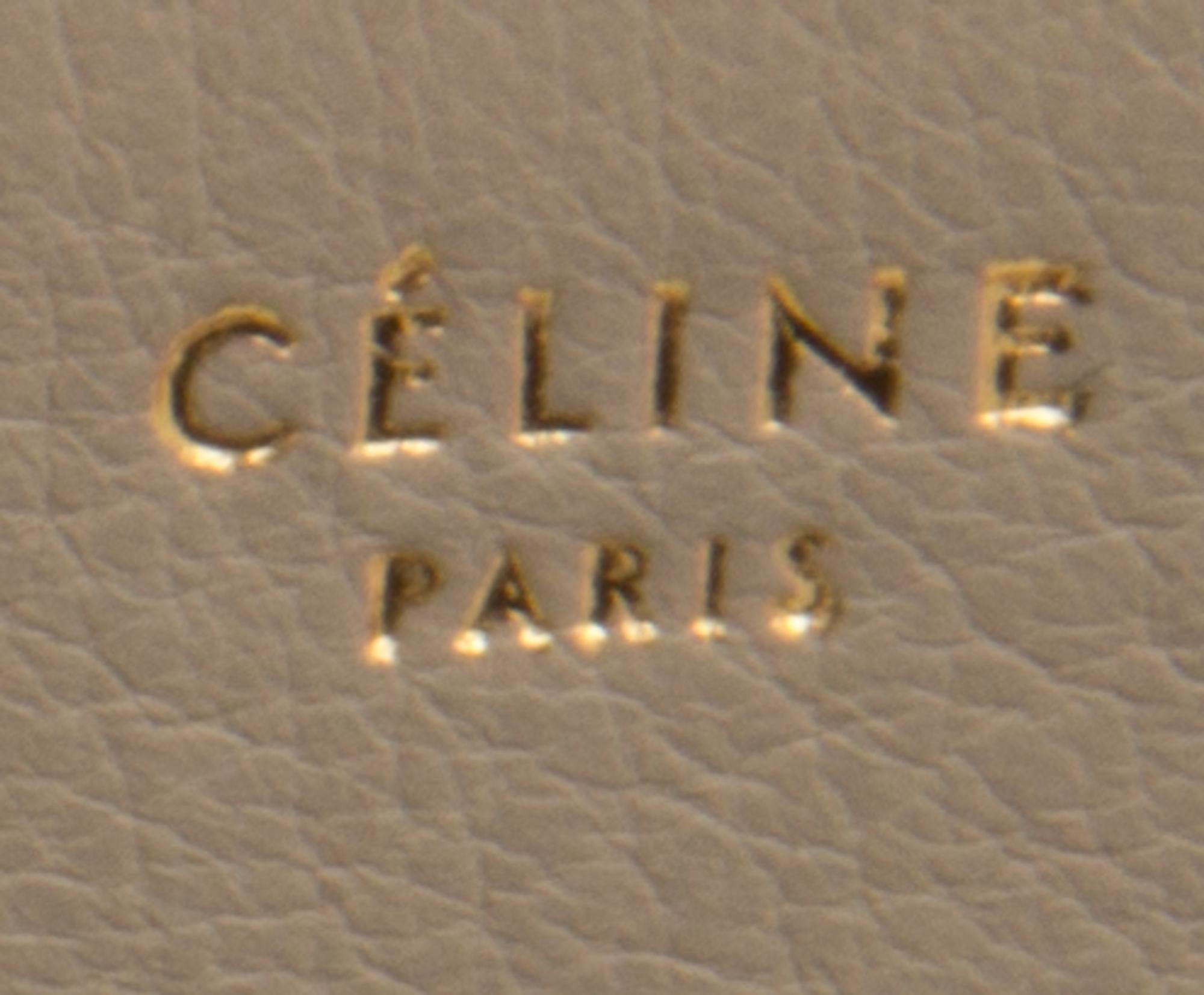 A Celine Taupe and Black Leather Edge Handbag, 14" x 11" x 7".