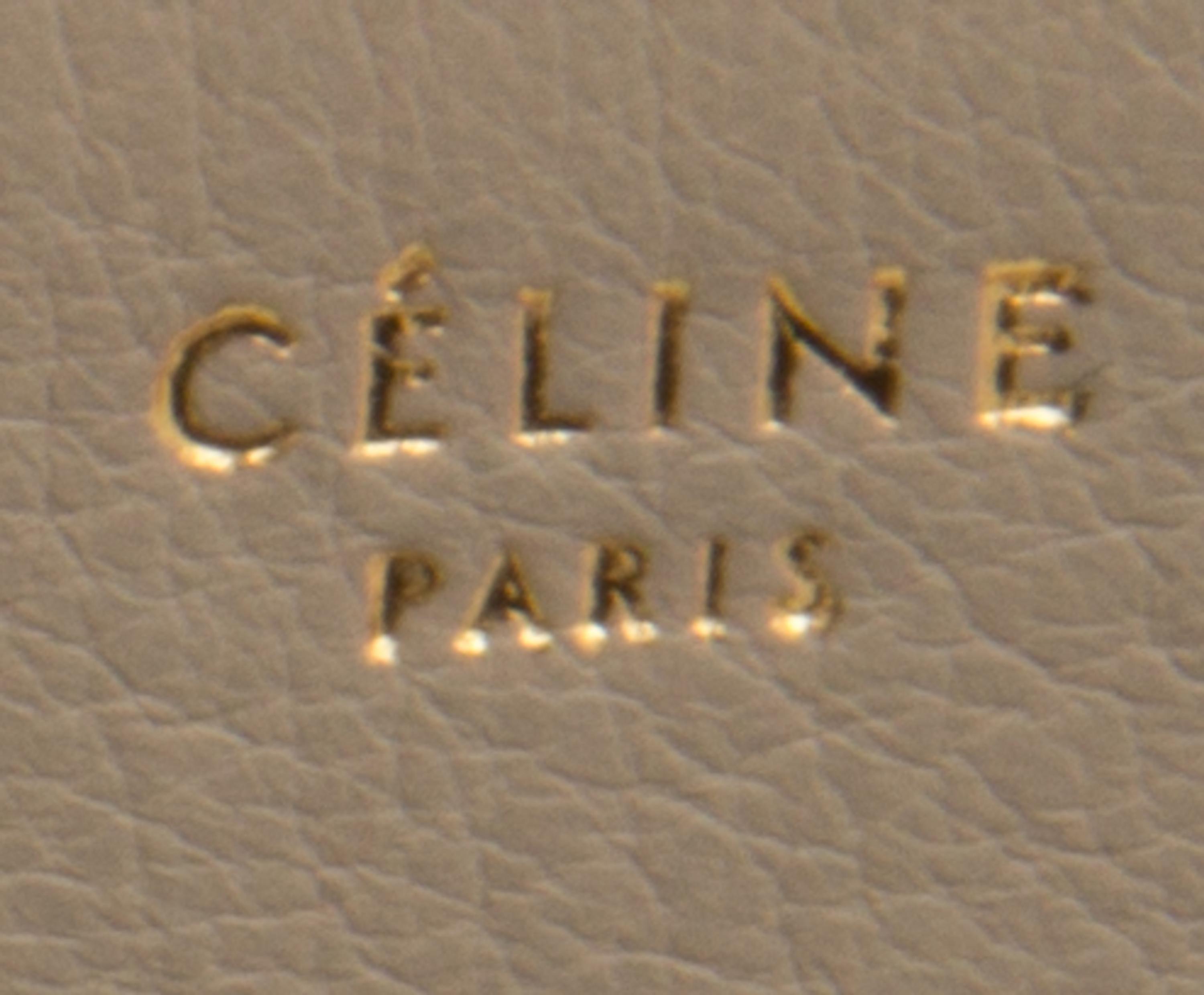 A Celine Taupe and Black Leather Edge Handbag, 14" x 11" x 7".