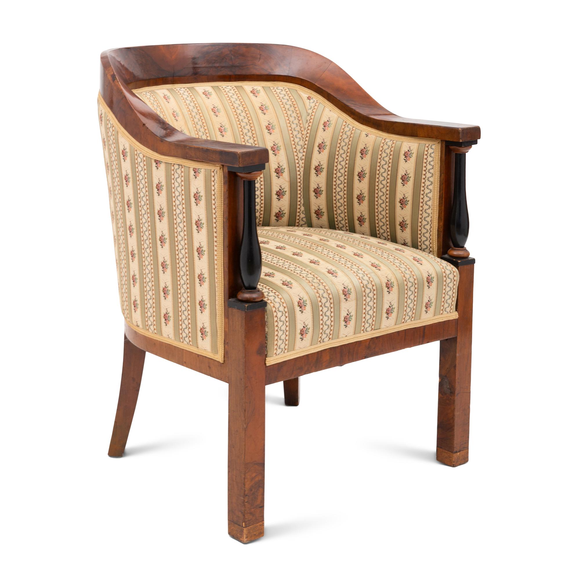 A Biedermeier Walnut and Ebonized Bergere