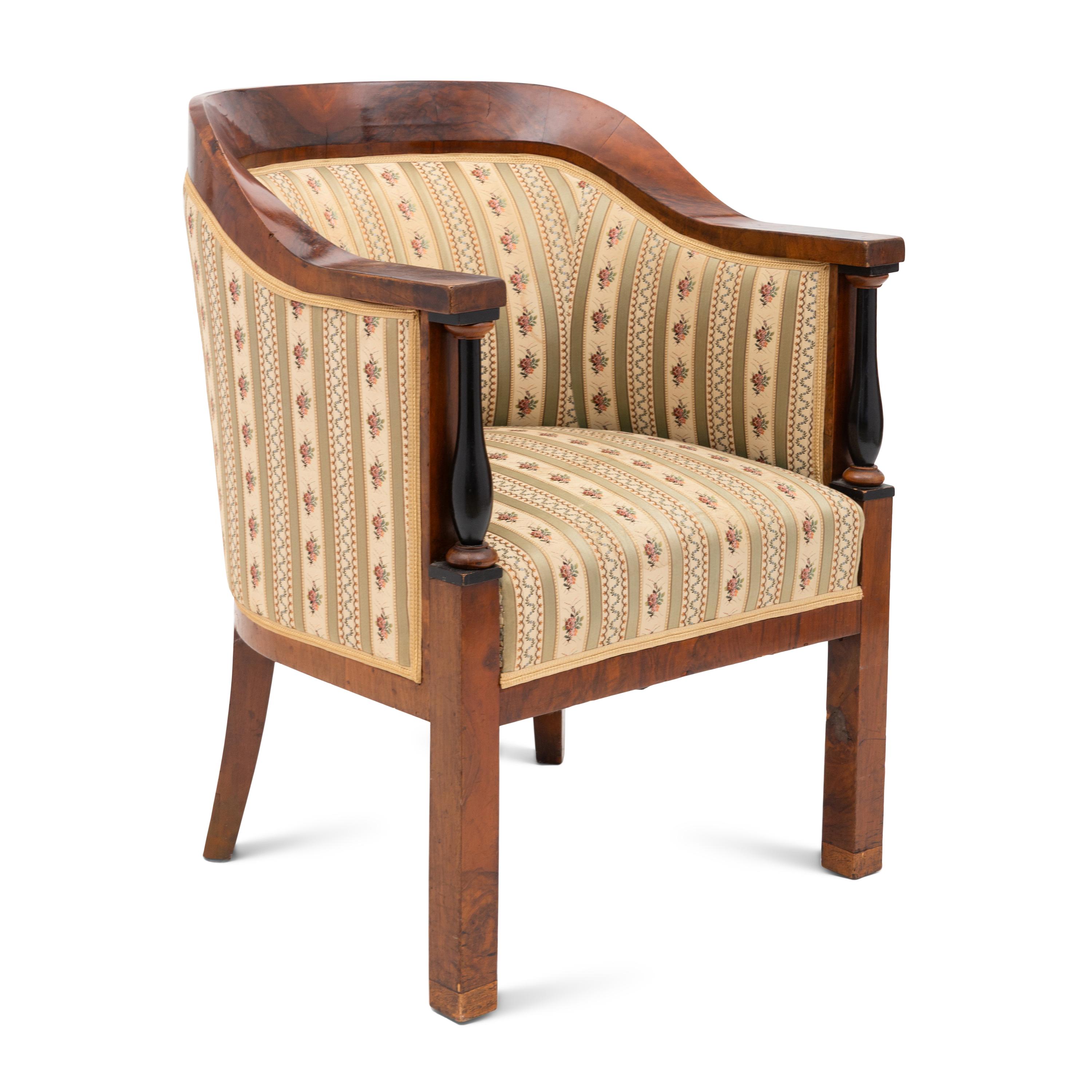 A Biedermeier Walnut and Ebonized Bergere
