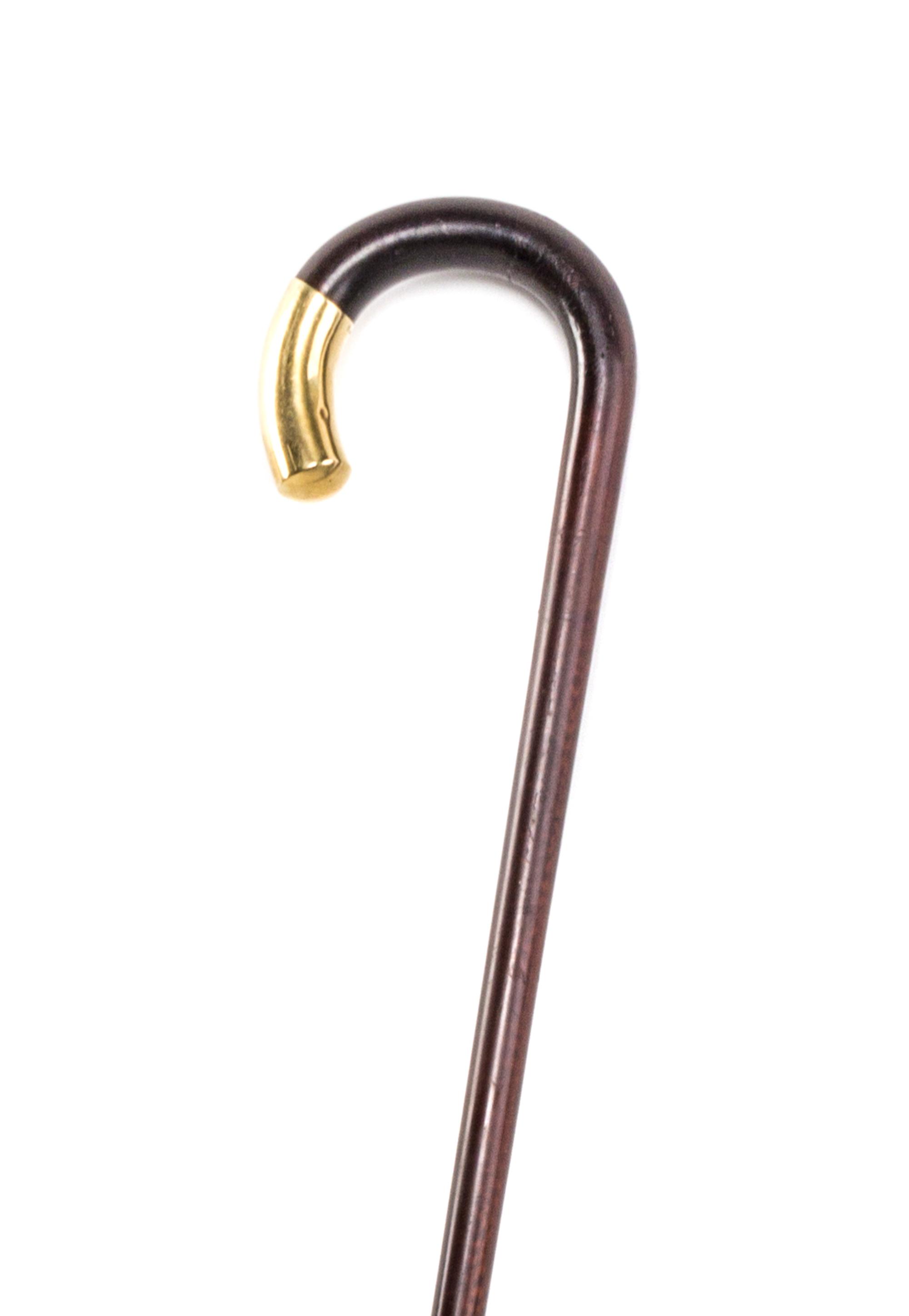 A 14 Karat Gold Capped Cane, Length of cap 2 1/2 x length overall 34 1/2 inches.
