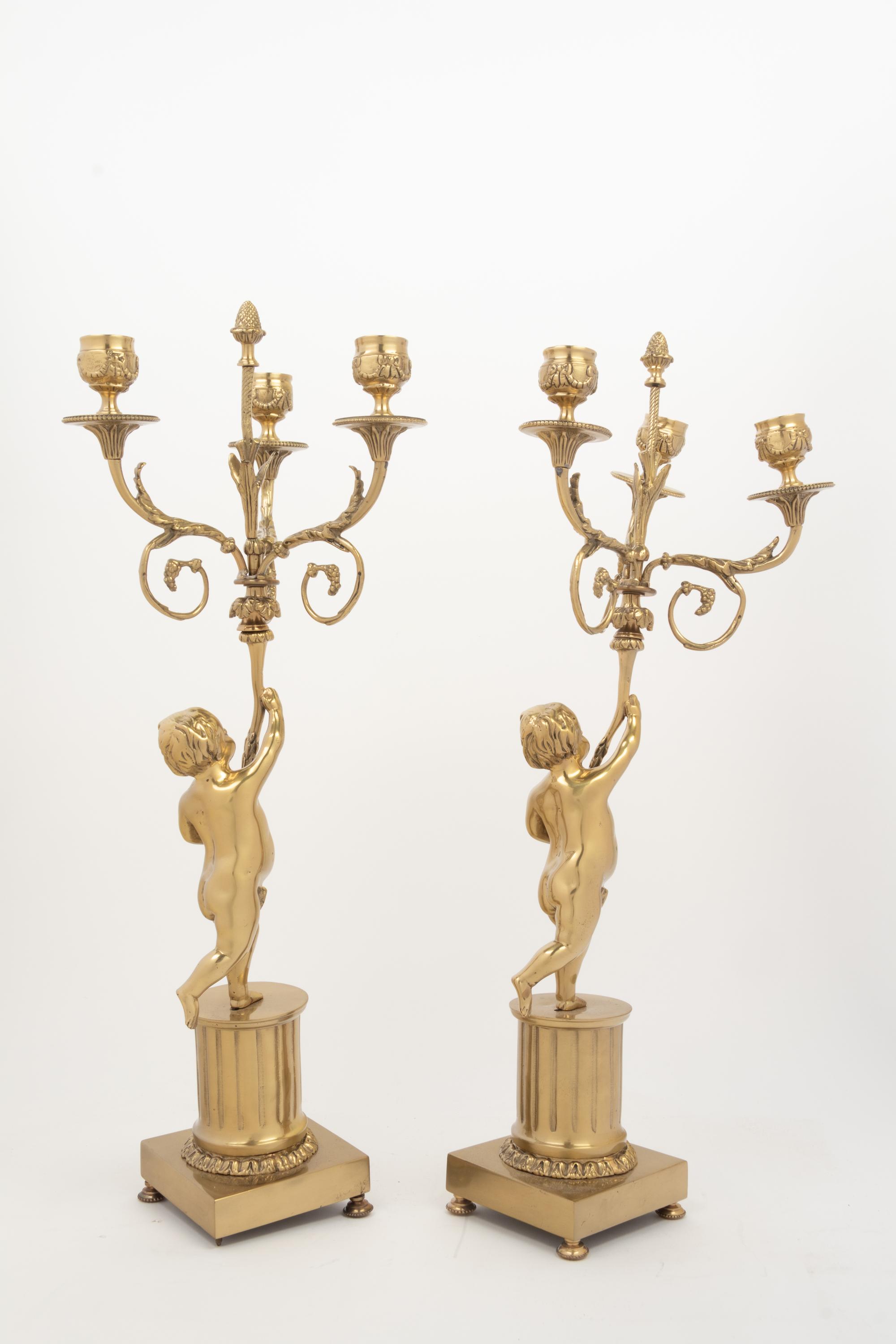 A Pair of Louis XV Style Gilt Metal Three-Light Candelabra